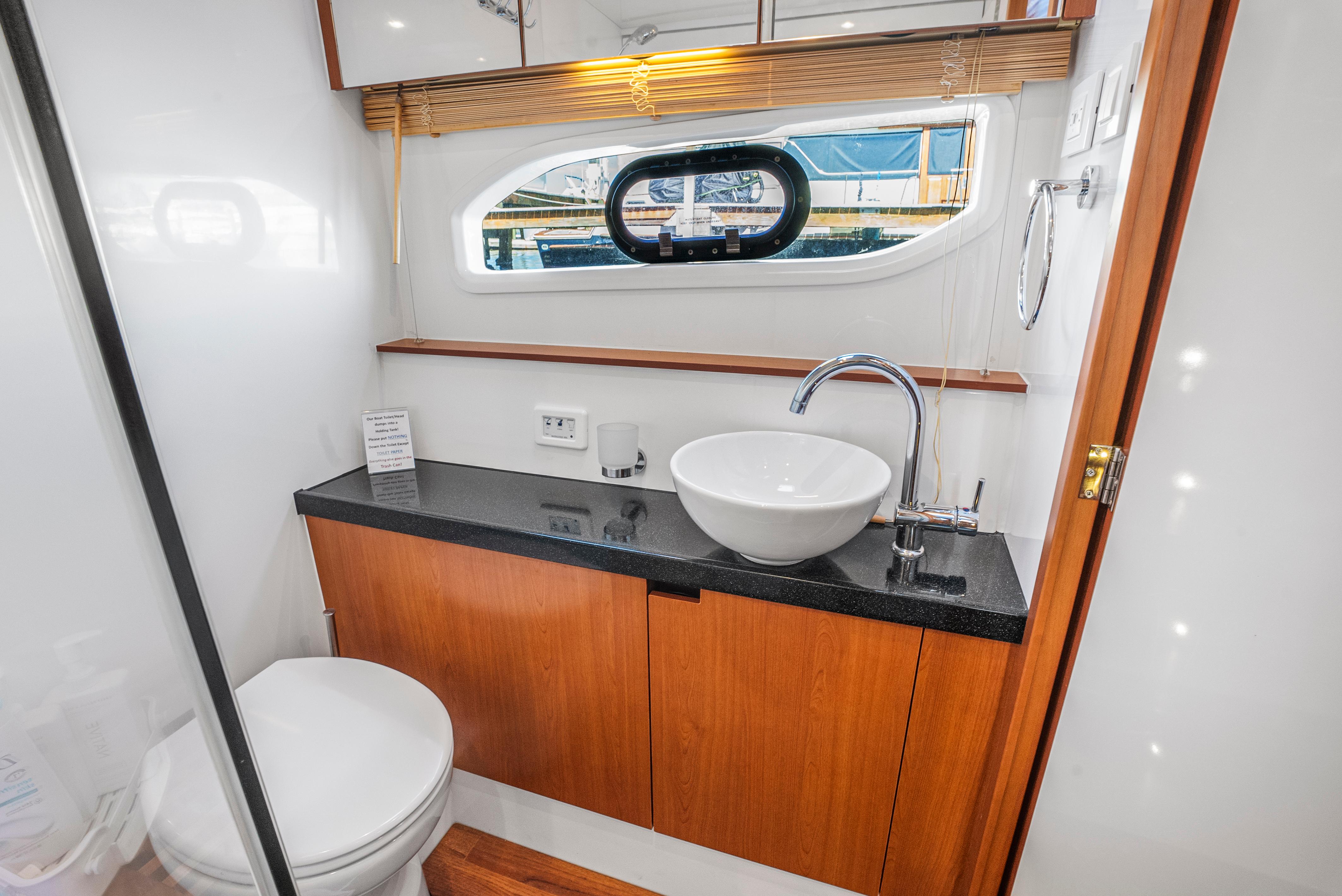 Aquila-44 Yacht 2017-Ryans Inheritance FL-US-Luxurious bathroom in 2017 Aquila 44 Yacht with modern sink and wooden cabinetry.-9835915 | Thumbnail