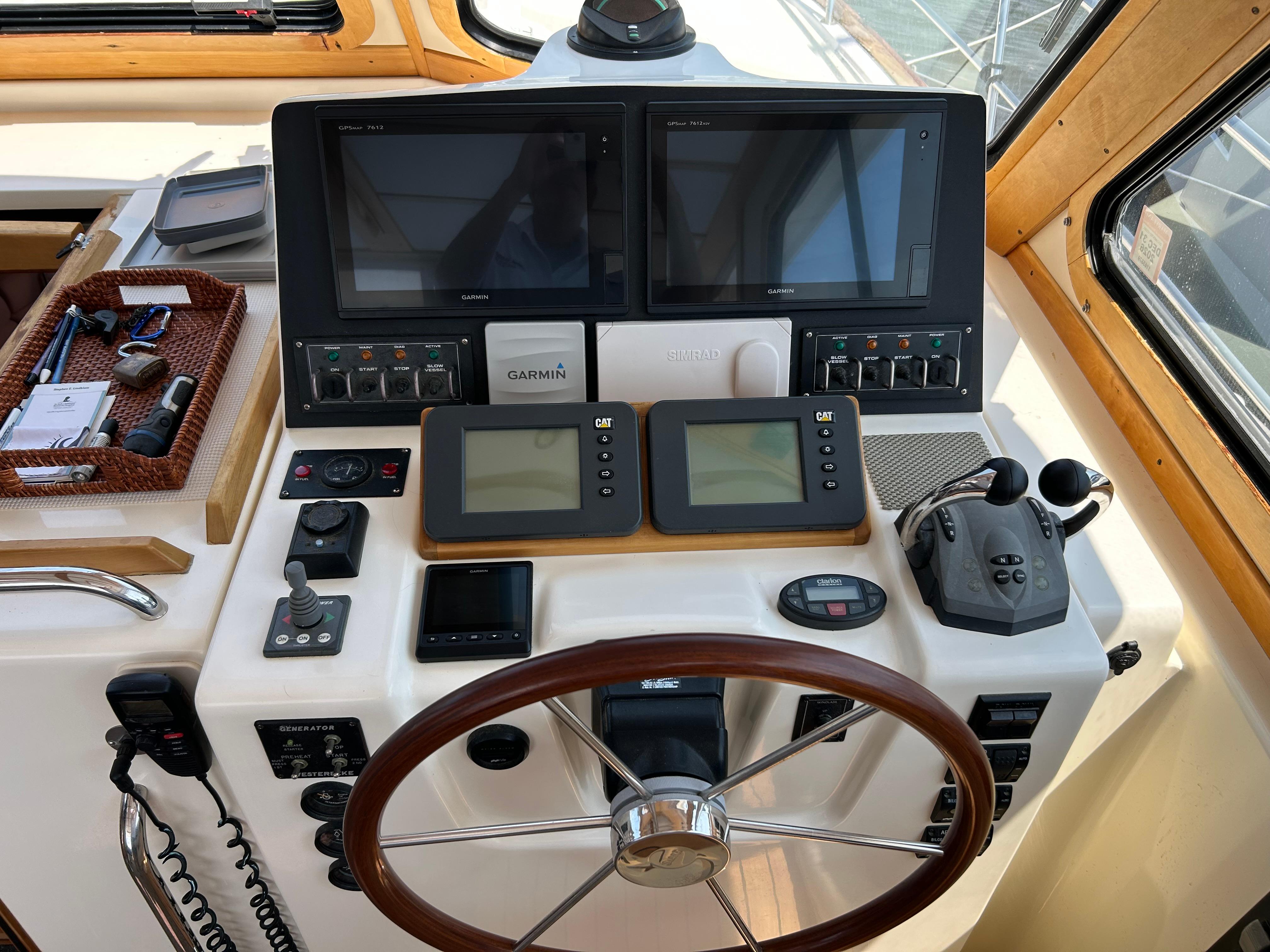 2005 Sabre 42 Hardtop Express helm with navigation screens and controls.