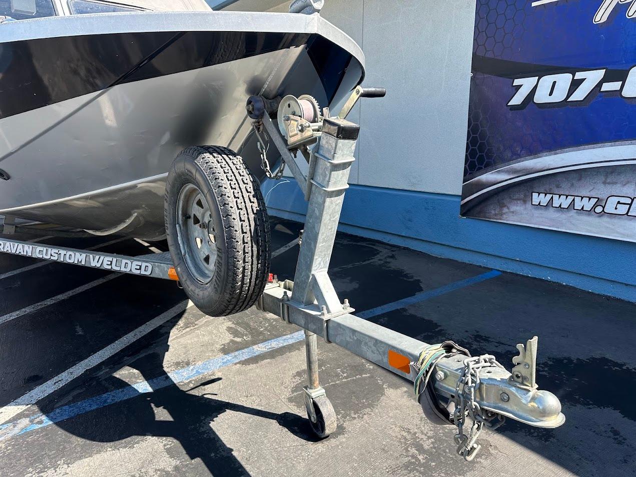Trailer hitch of a 2008 Jetcraft 1925 Adventurer boat in a parking lot.