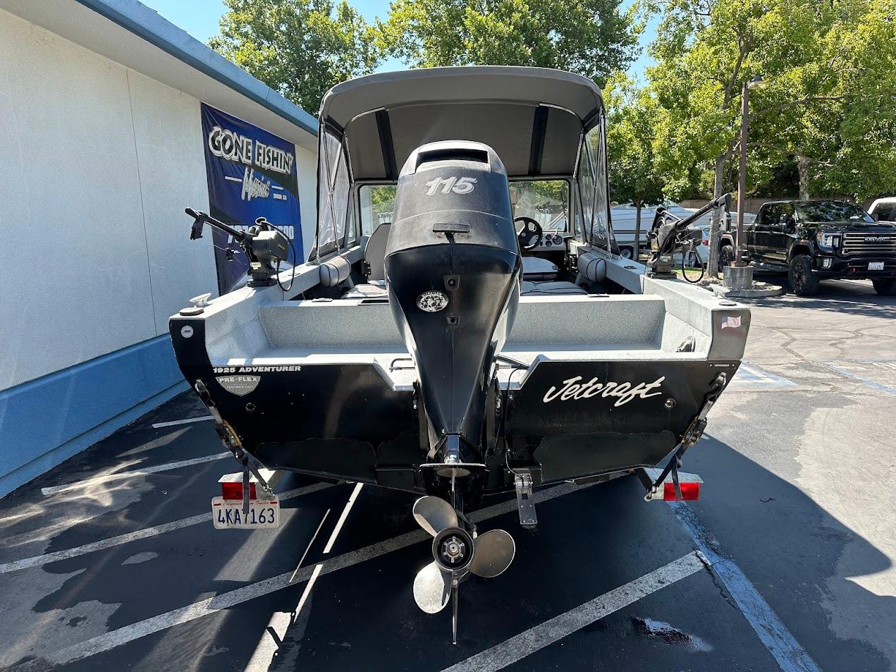 Jetcraft 1925 Adventurer boat, 2008 model, parked outdoors with visible motor and propeller.