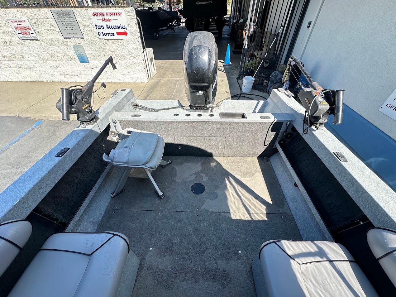 Interior of a 2008 Jetcraft 1925 Adventurer boat with fishing equipment and seating.