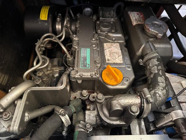 Engine of a 2000 Hunter 340 sailboat, showcasing intricate mechanical components.