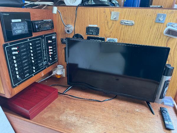 Control panel and monitor inside a 2000 Hunter 340 sailboat cabin.