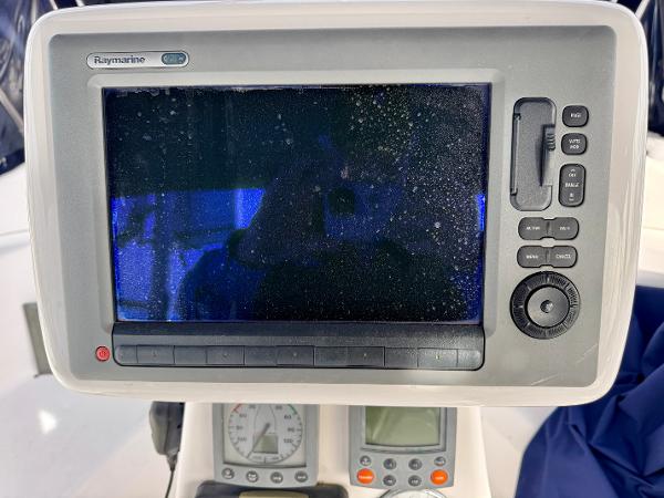 Raymarine navigation system on 2000 Hunter 340 sailboat, featuring control panel and display.
