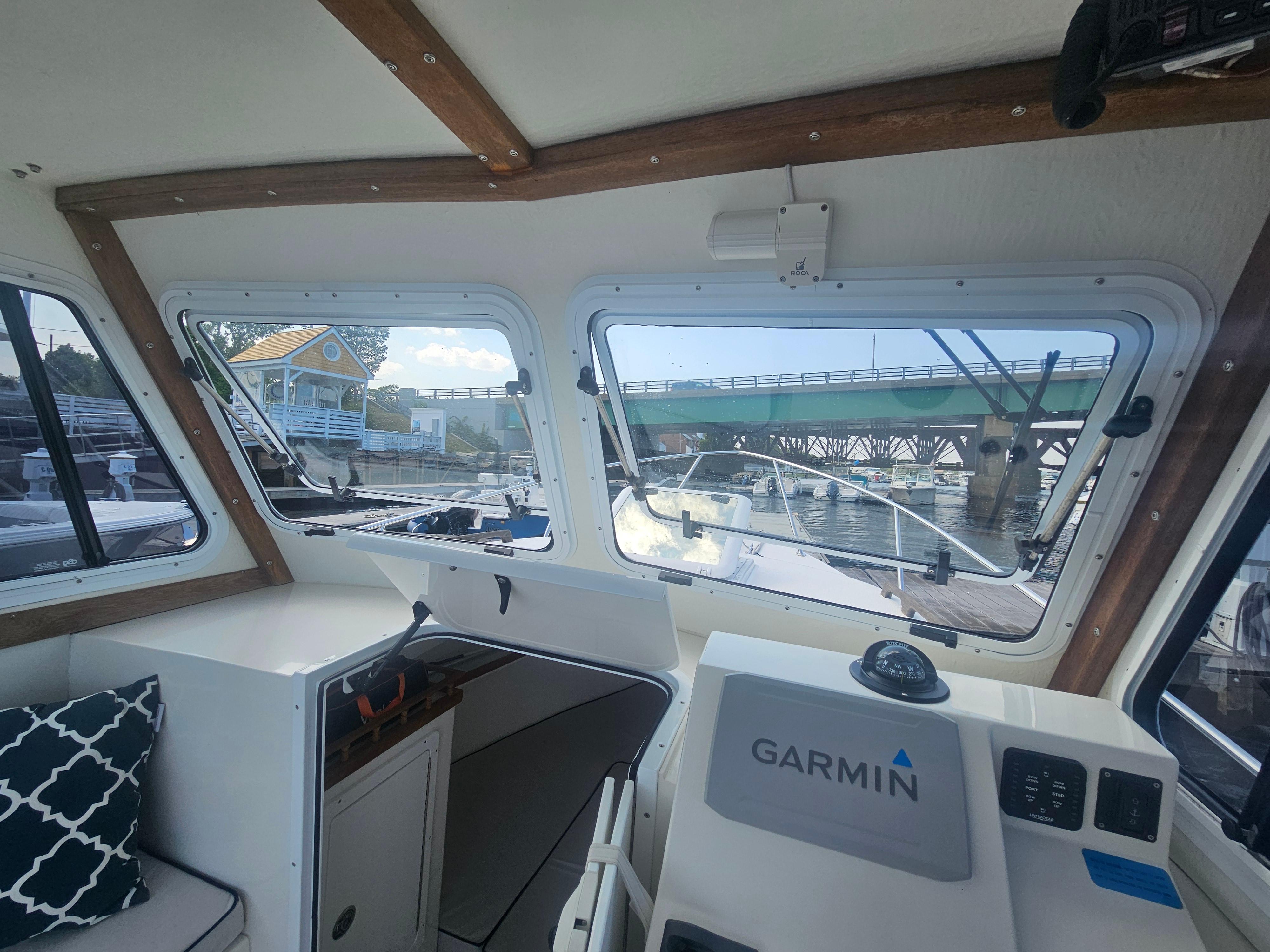 Interior view of 2019 Eastern 248 Explorer boat with Garmin navigation system.