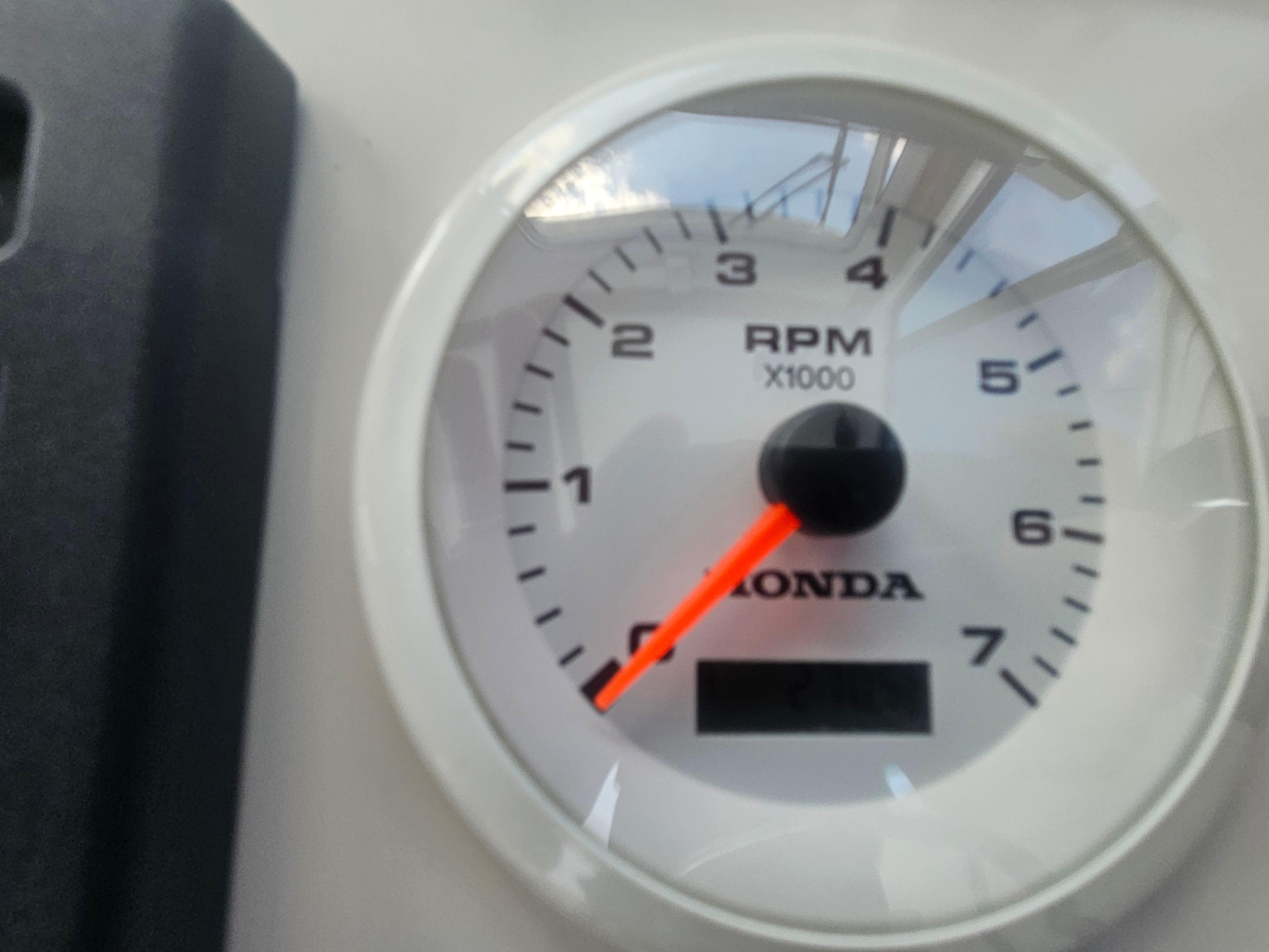 Close-up of a Honda RPM gauge on a 2019 Eastern 248 Explorer boat.