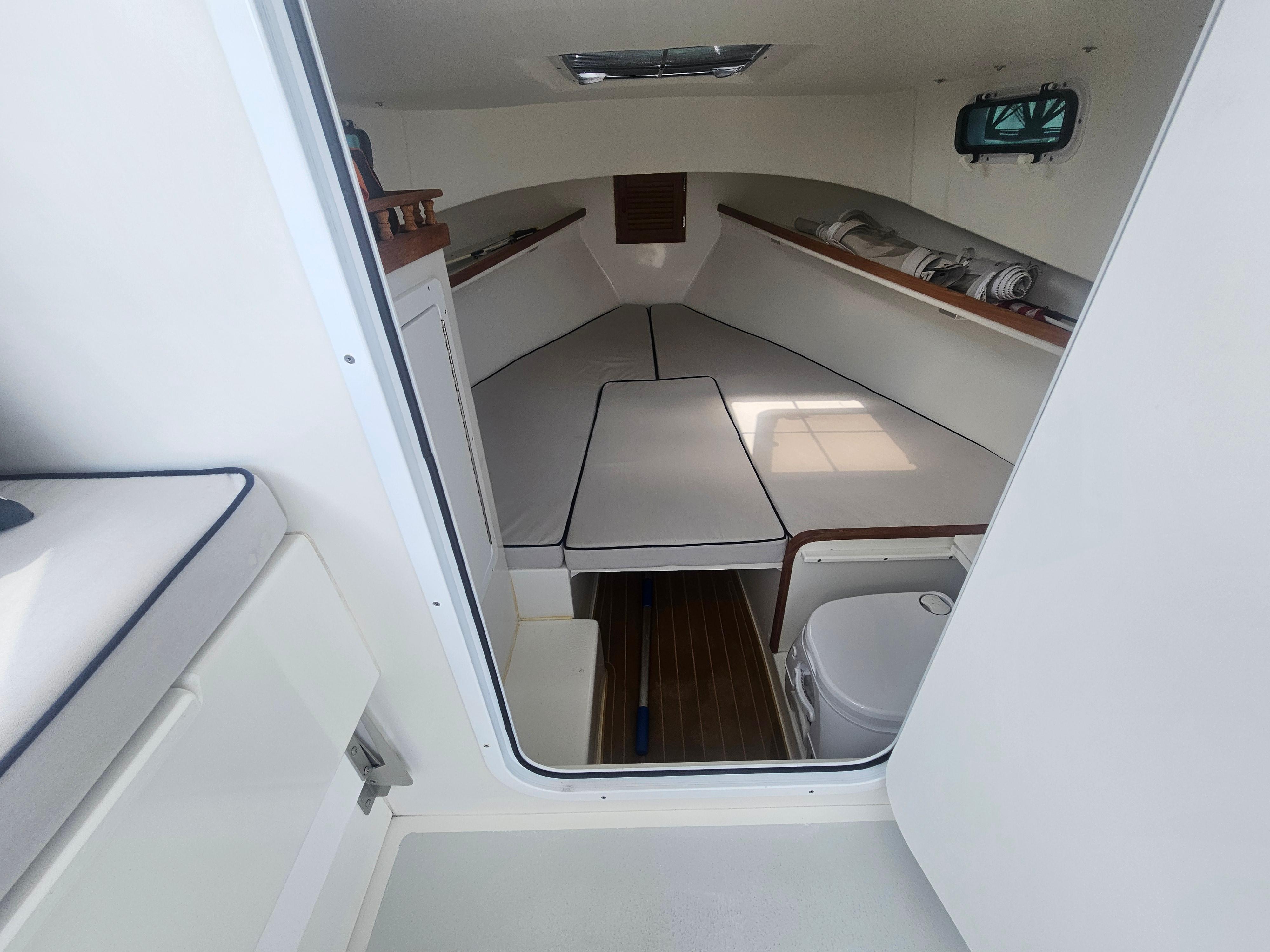 2019 Eastern 248 Explorer cabin interior with seating and storage.