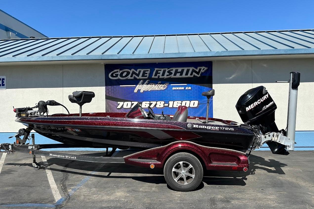 2010 Ranger 178 VS boat with Mercury engine parked outside a fishing store.