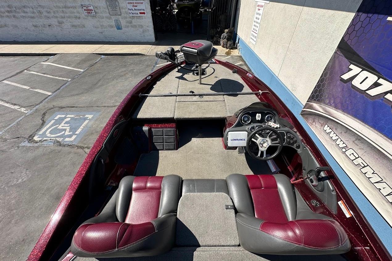 2010 Ranger 178 VS boat interior with red and gray seating, steering wheel, and Lowrance device.