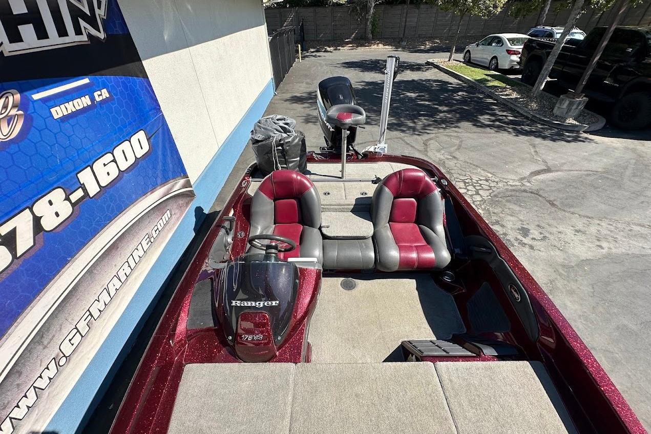 2010 Ranger 178 VS boat with red and gray seating, parked outdoors.