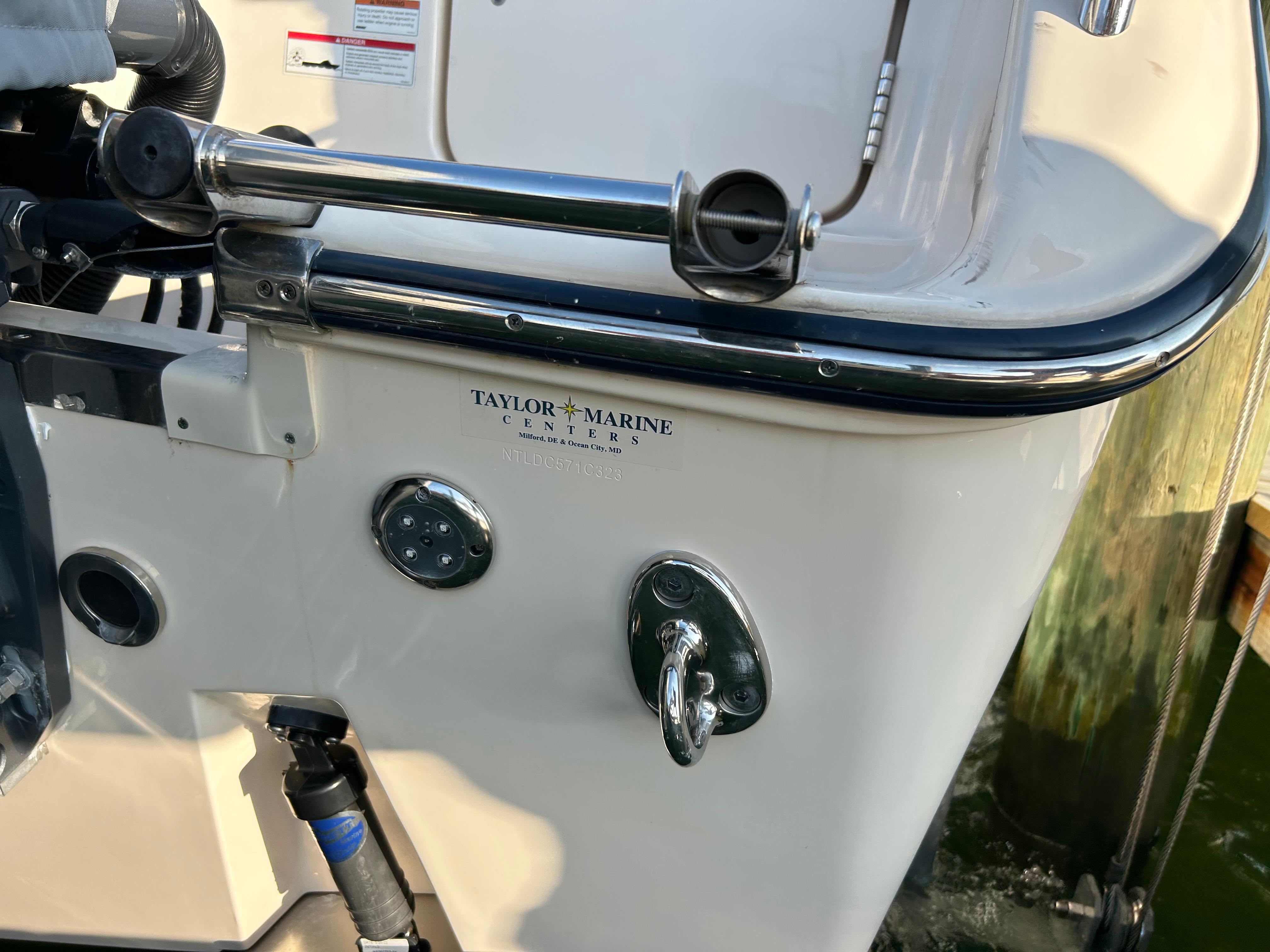 2023 Grady-White Freedom 275 boat stern with Taylor Marine Centers logo.