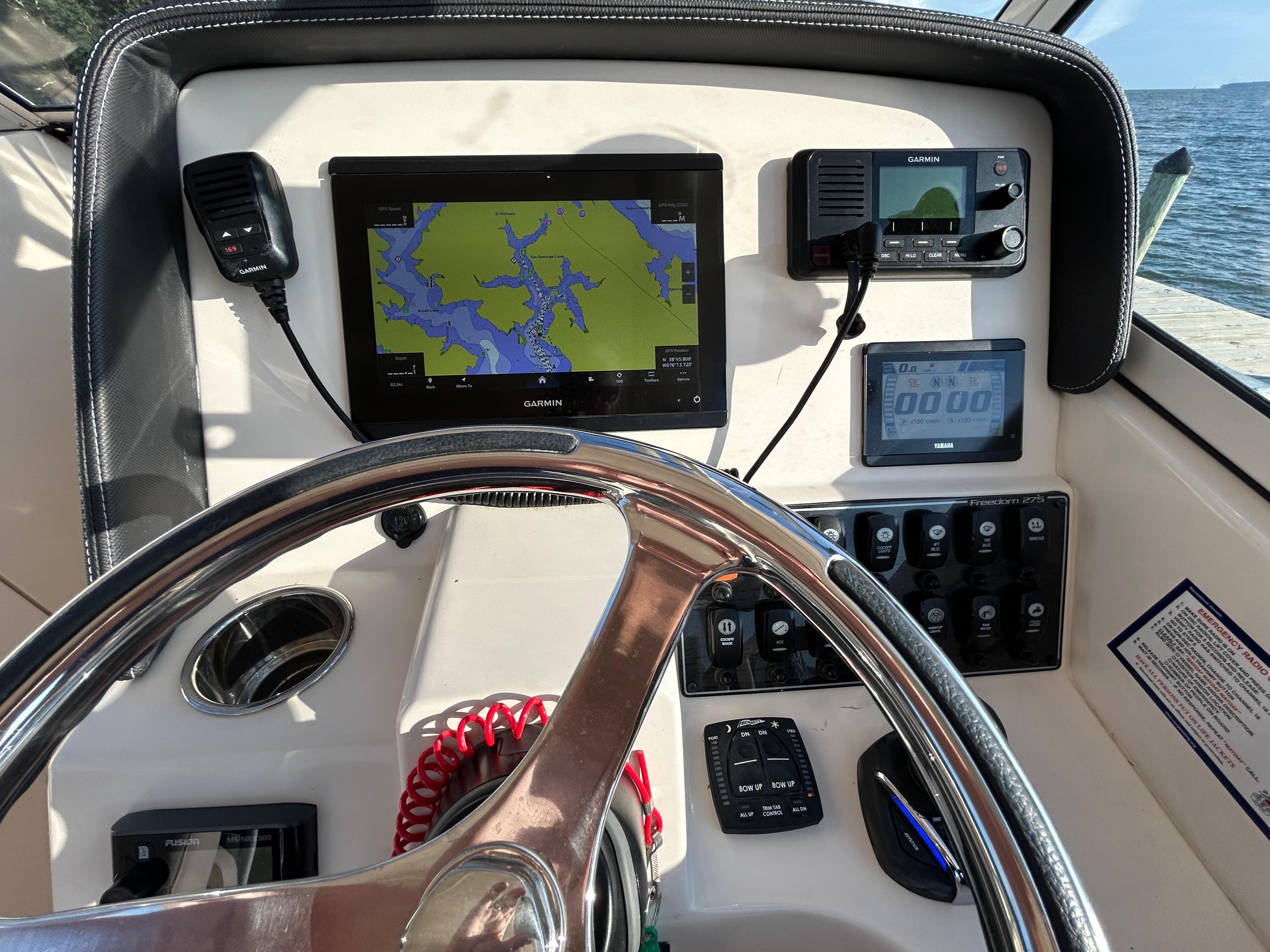 Dashboard of 2023 Grady-White Freedom 275 boat with navigation and control systems.