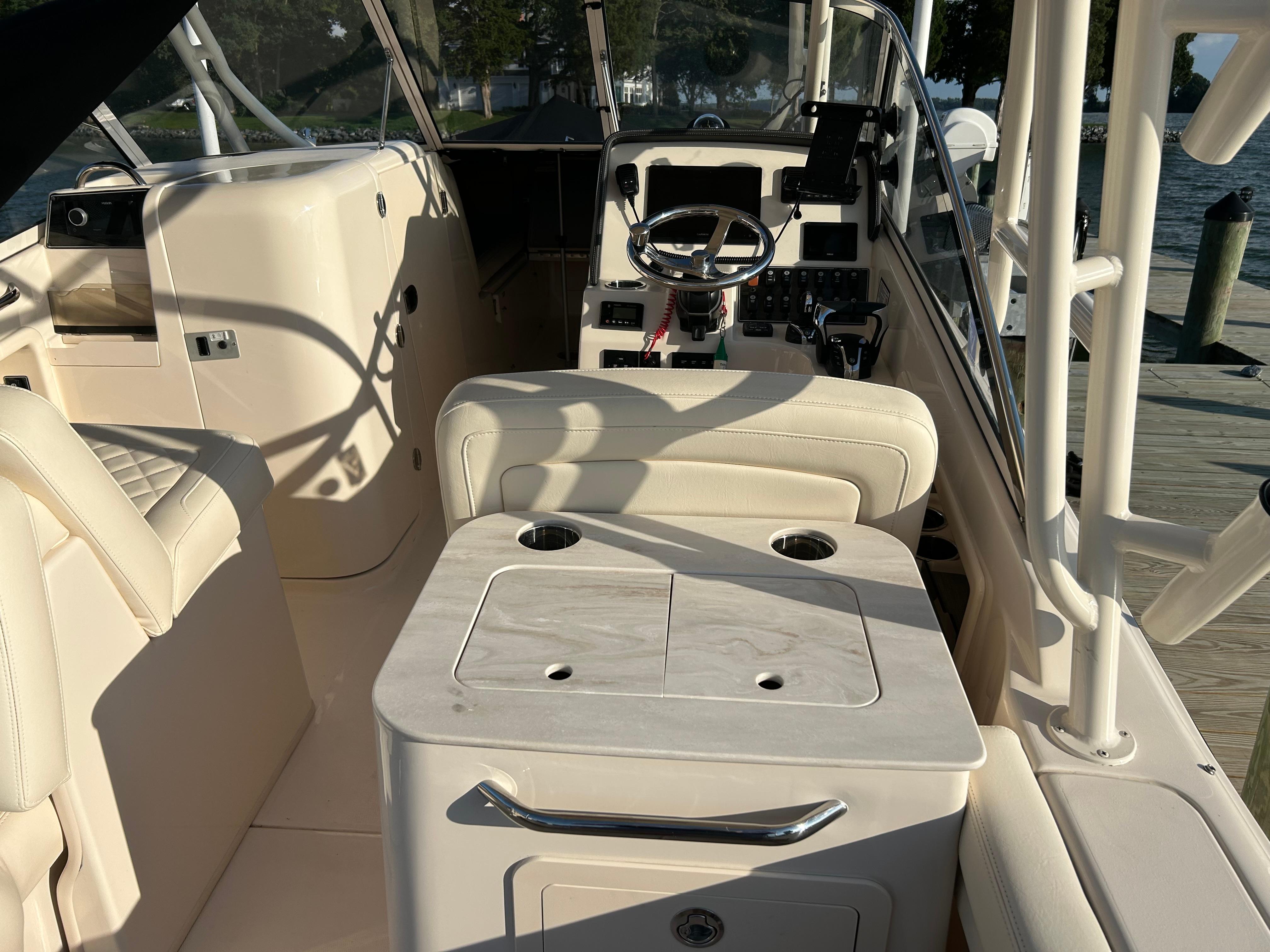 2023 Grady-White Freedom 275 boat interior with helm and seating area.