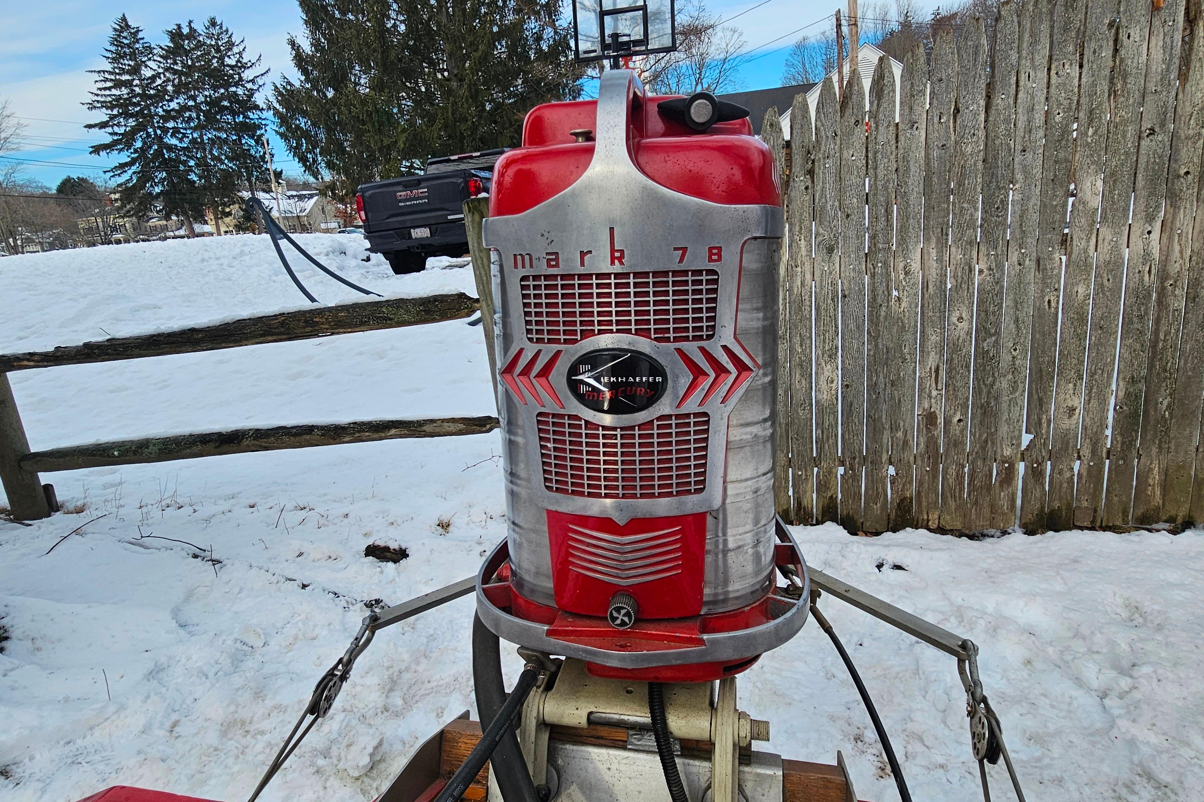 Vintage 1987 De Silva F Class Race boat engine in snowy outdoor setting.