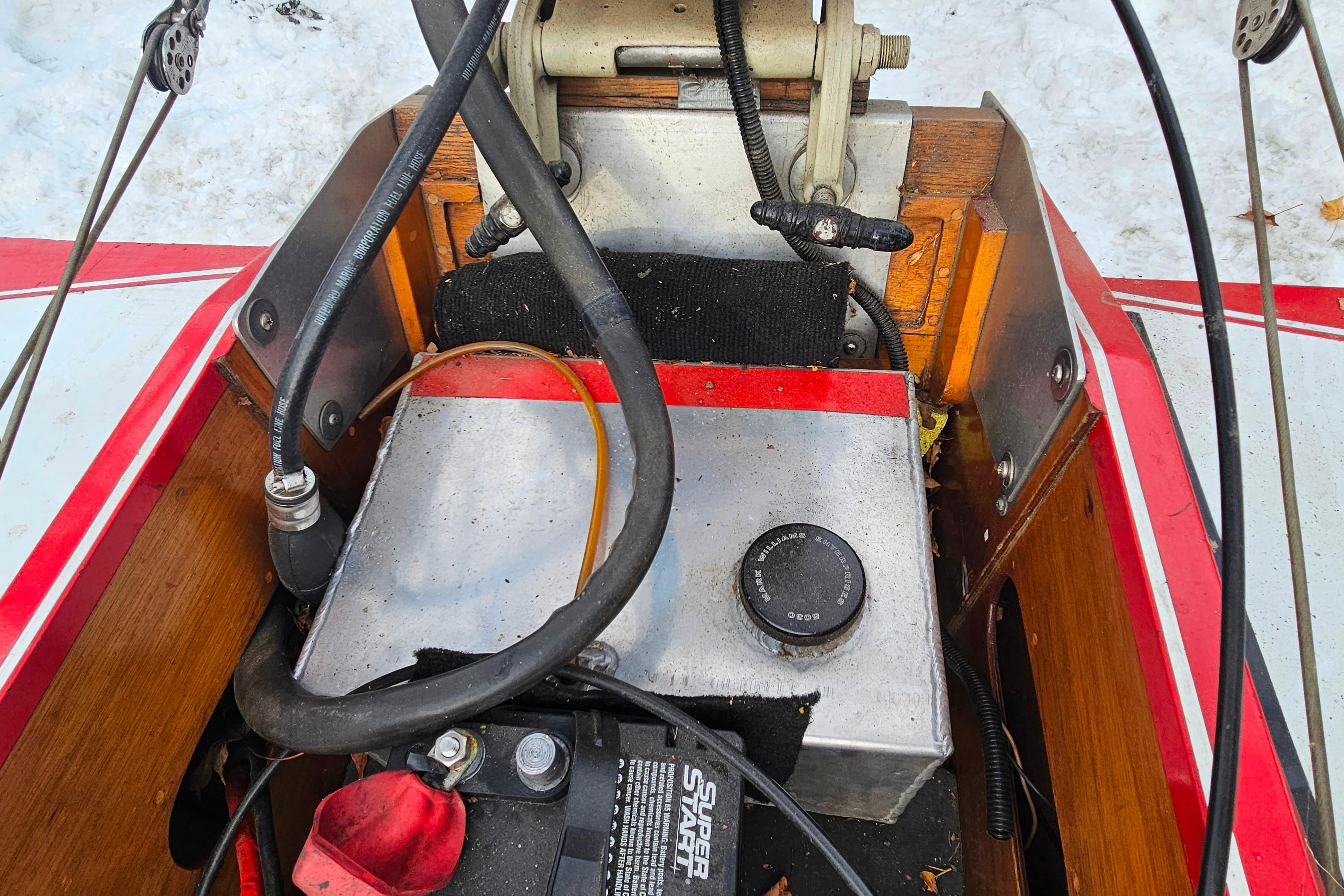 1987 De Silva F Class Race boat interior with mechanical components and wiring.
