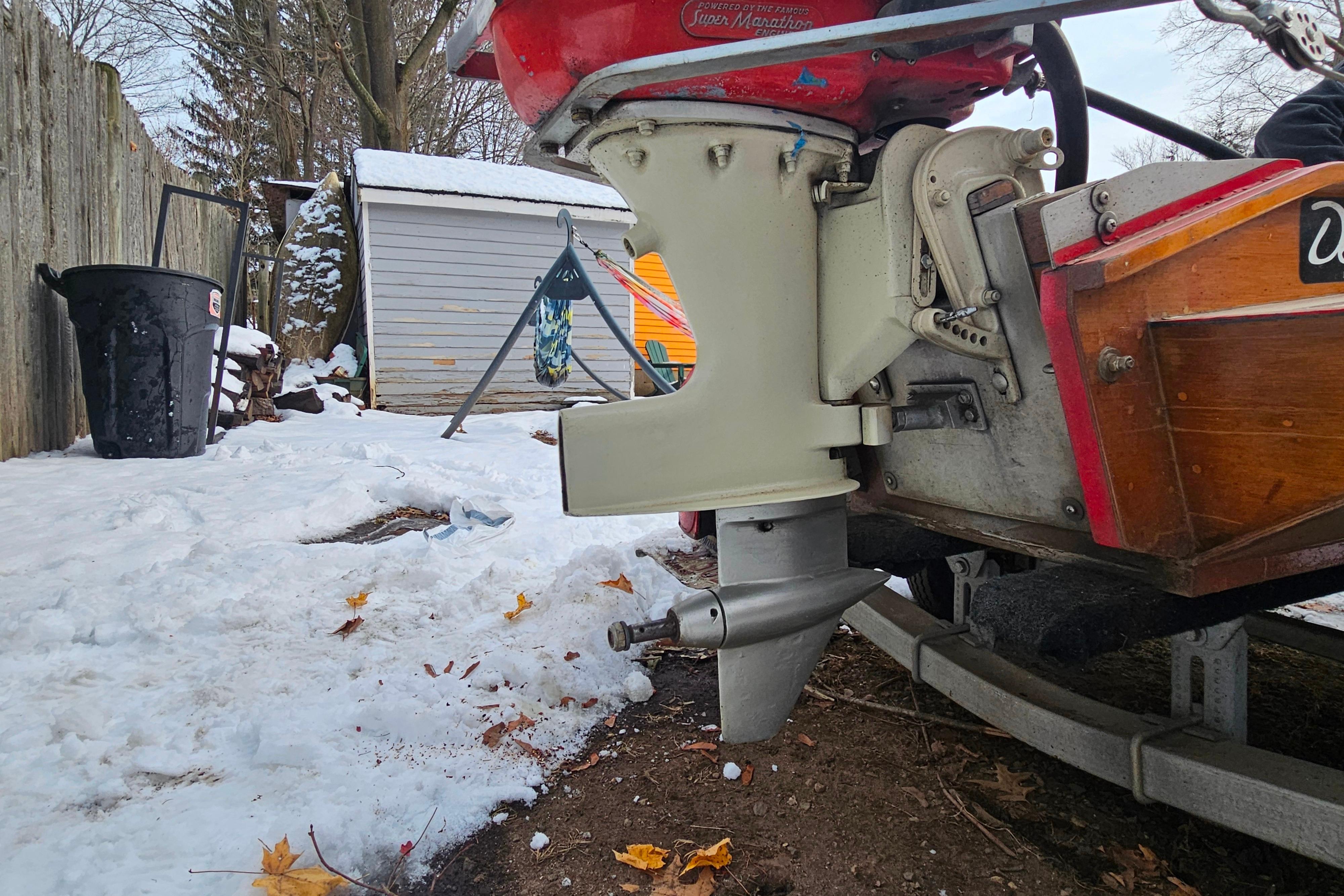 1987 De Silva F Class Race boat engine in snowy backyard setting.