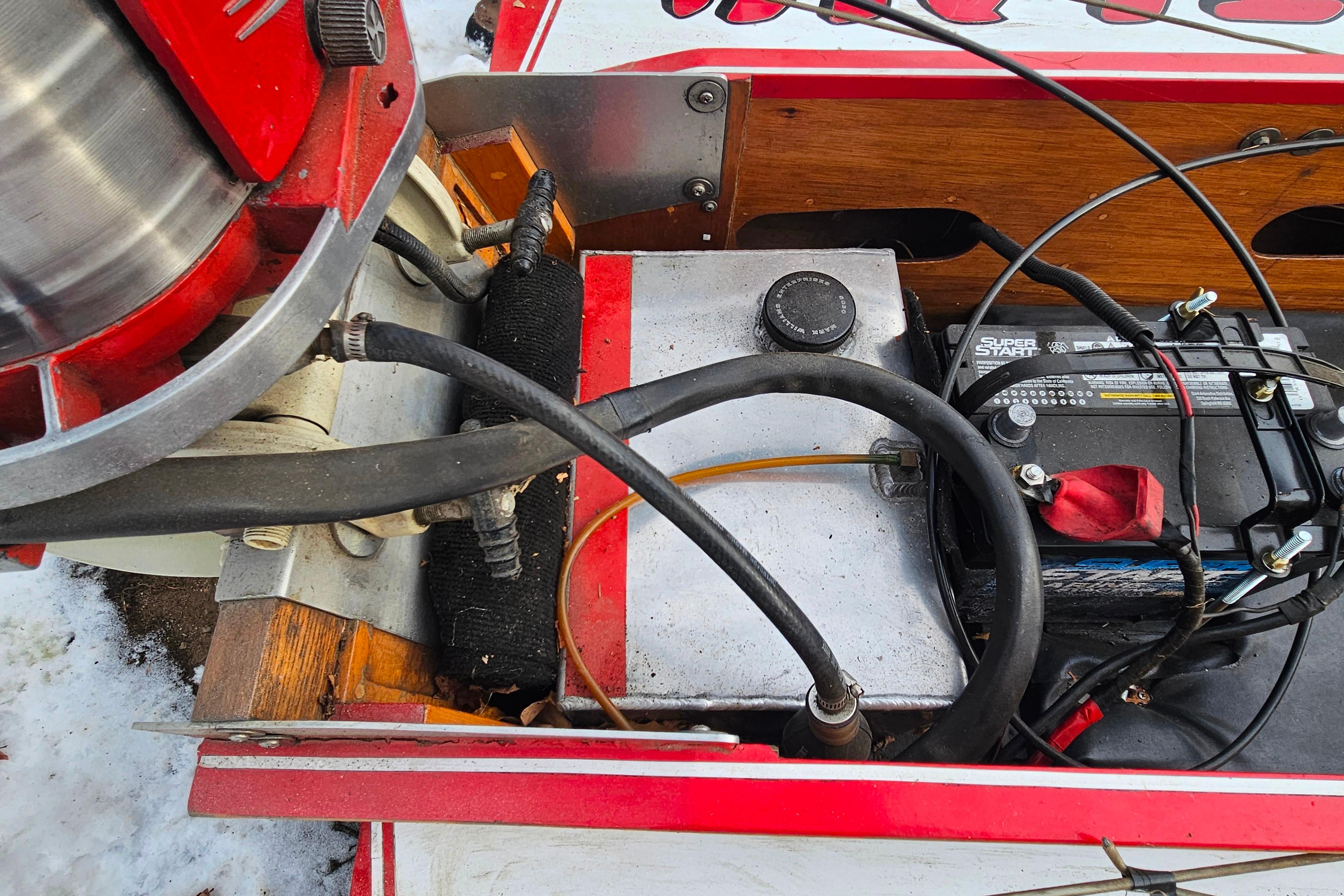1987 De Silva F Class Race boat engine compartment with battery and wiring.