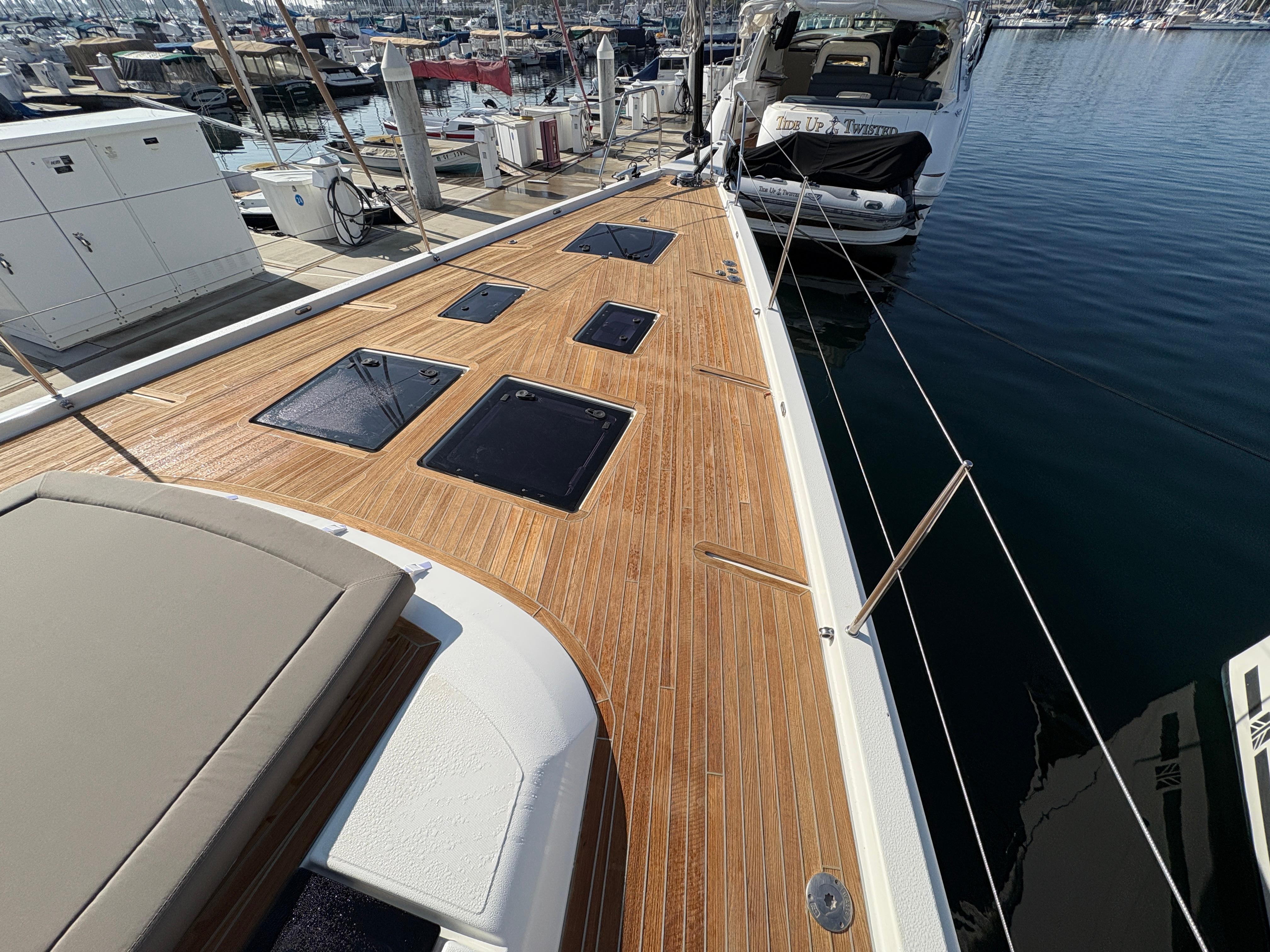 Dufour-560 Exclusive 2018-560 Exclusive US-2018 Dufour 560 Exclusive yacht with teak deck, docked at marina.-9765971 | Thumbnail