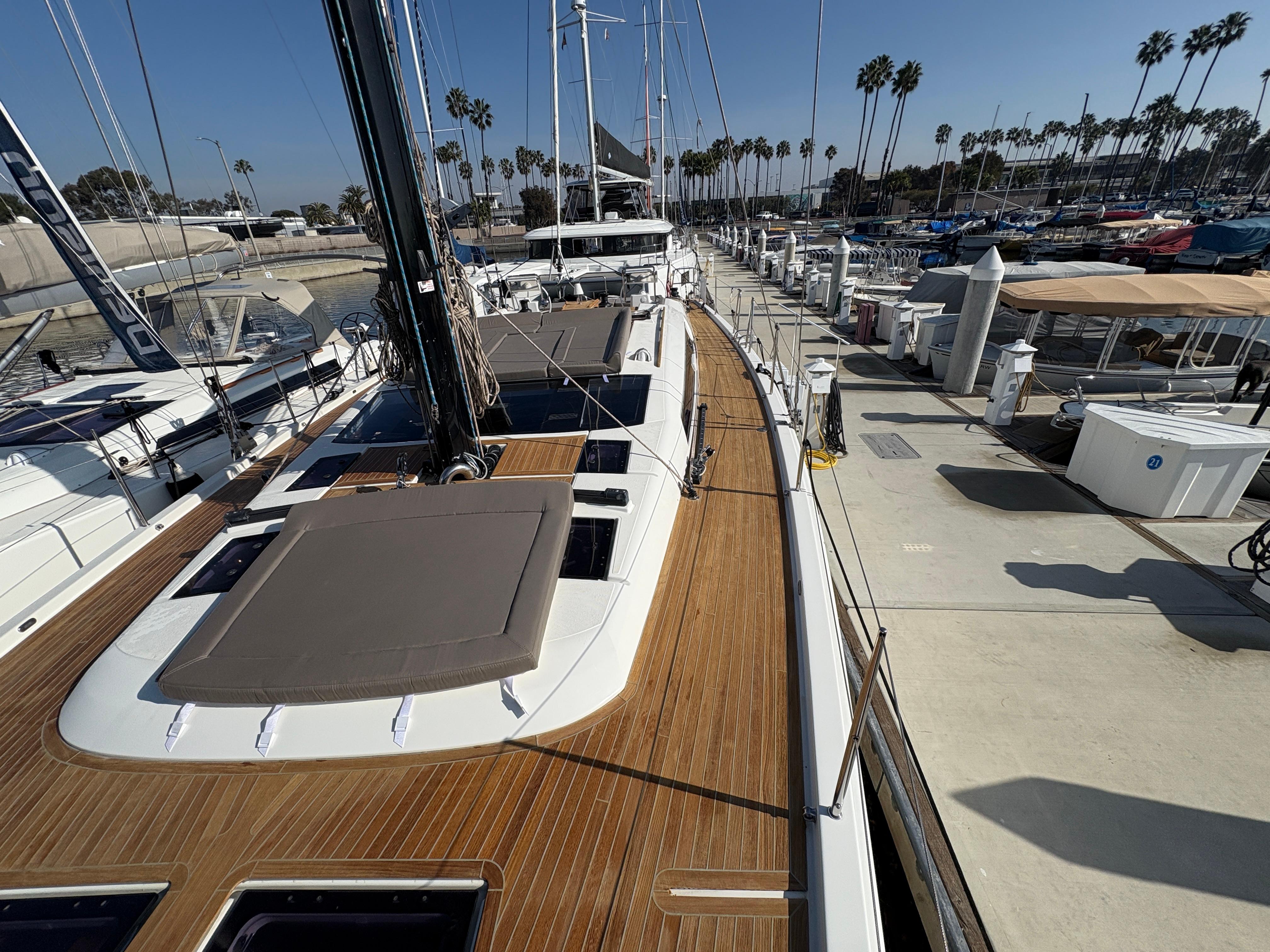 Dufour-560 Exclusive 2018-560 Exclusive US-2018 Dufour 560 Exclusive yacht docked at marina, showcasing sleek deck design and modern features.-9765971 | Thumbnail