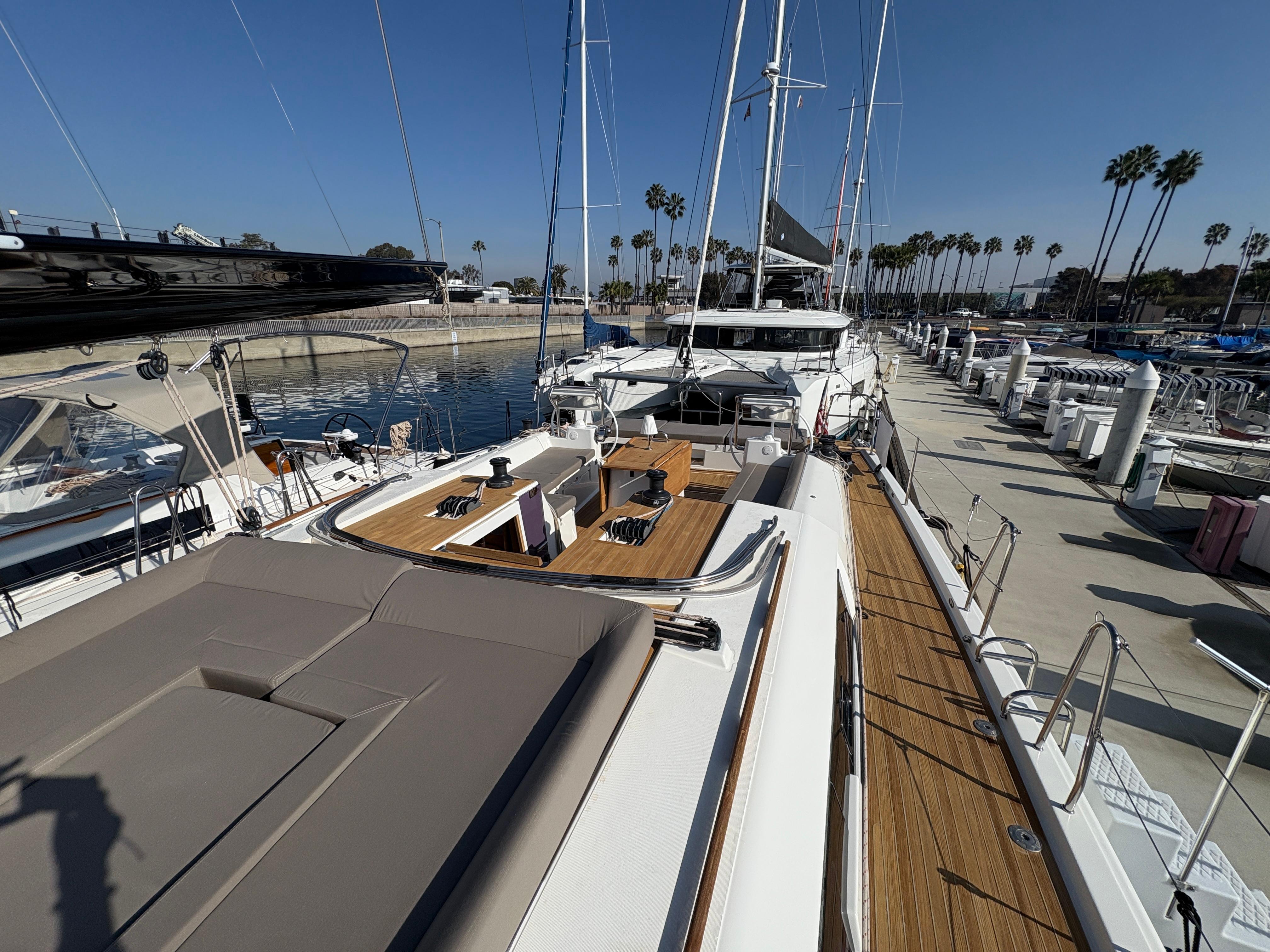 Dufour-560 Exclusive 2018-560 Exclusive US-2018 Dufour 560 Exclusive yacht docked at marina, showcasing spacious deck and elegant design.-9765971 | Thumbnail