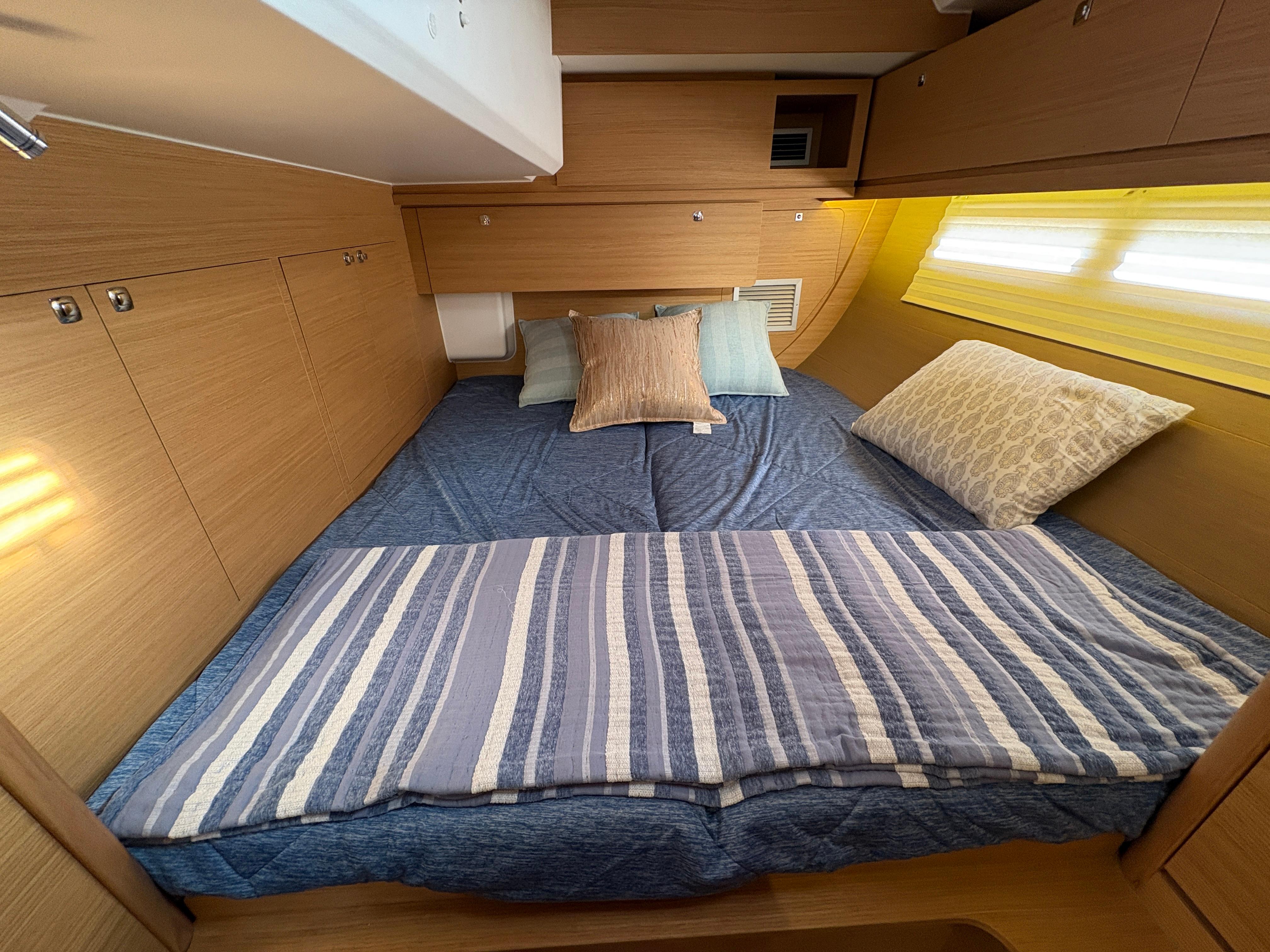 Dufour-560 Exclusive 2018-560 Exclusive US-Cozy cabin interior of 2018 Dufour 560 Exclusive yacht with comfortable bedding.-9765971 | Thumbnail