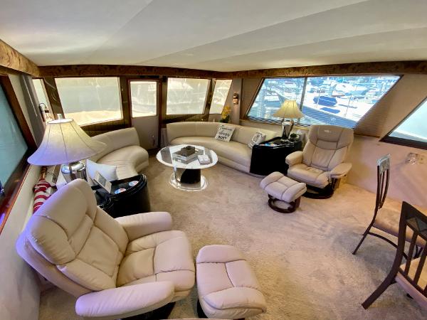 Hatteras 70 Conundrum - Salon, Port and Starboard Seating, with Table