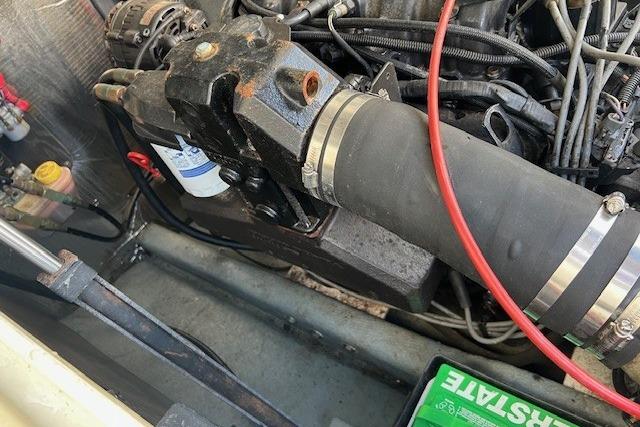 Engine compartment of a 2001 Carolina Classic 25 Classic boat, showing mechanical components.