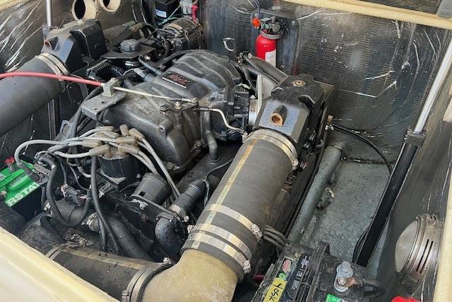 Engine compartment of a 2001 Carolina Classic 25 Classic boat, featuring visible components.
