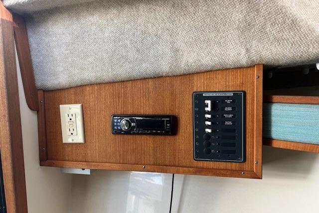 2001 Carolina Classic 25 Classic boat interior with control panel and stereo system.