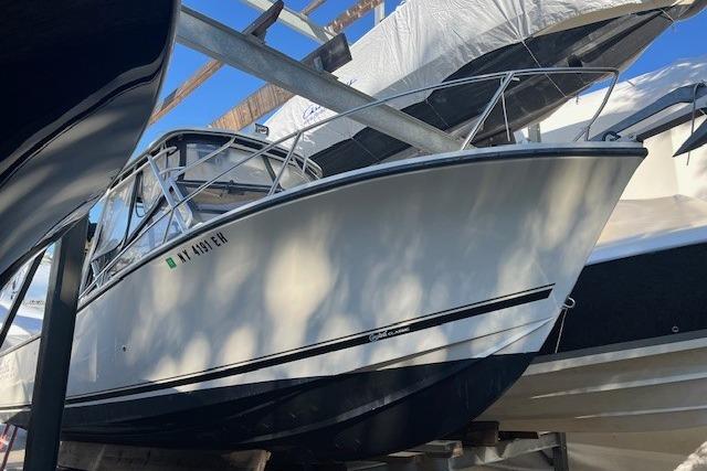 2001 Carolina Classic 25 Classic boat on a trailer, side view.