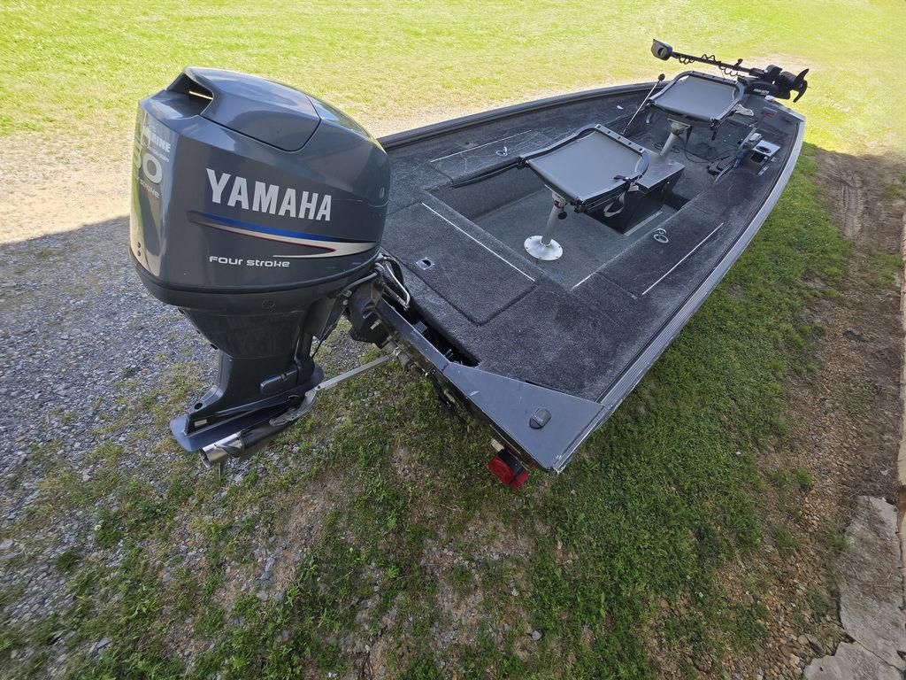 2008 Xpress XP16PF Stick-Steer boat with Yamaha four-stroke engine on grassy area.
