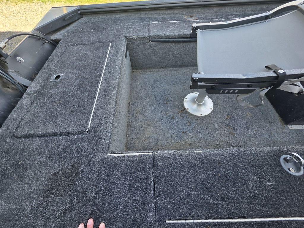 2008 Xpress XP16PF Stick-Steer boat interior with gray carpet and seating area.