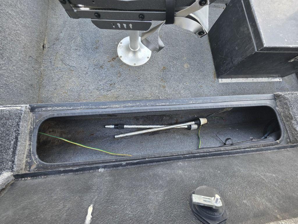 2008 Xpress XP16PF Stick-Steer boat interior with storage compartment and fishing rod.