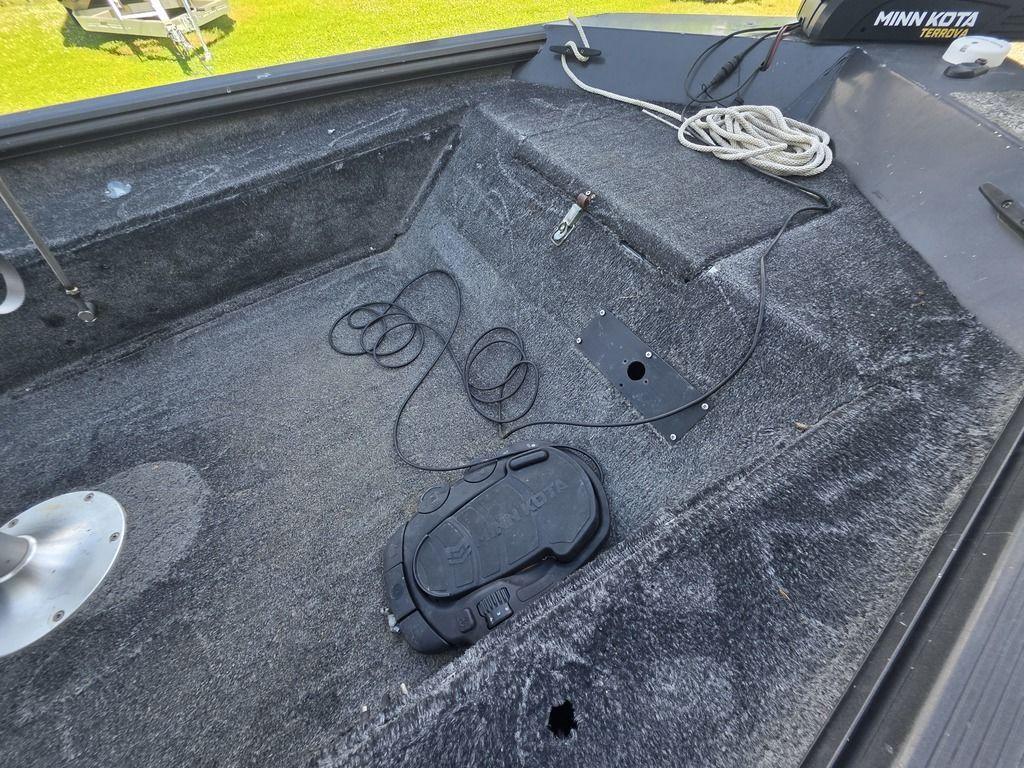 2008 Xpress XP16PF Stick-Steer boat interior with Minn Kota trolling motor and coiled rope.