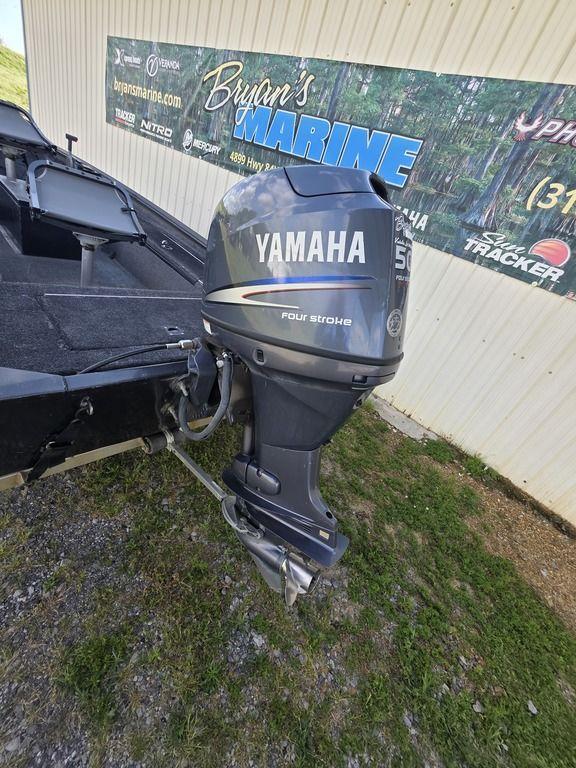 2008 Xpress XP16PF Stick-Steer boat with Yamaha 50HP outboard motor, parked near Bryan's Marine.