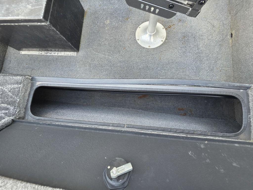 2008 Xpress XP16PF Stick-Steer boat interior with storage compartment and seat base.