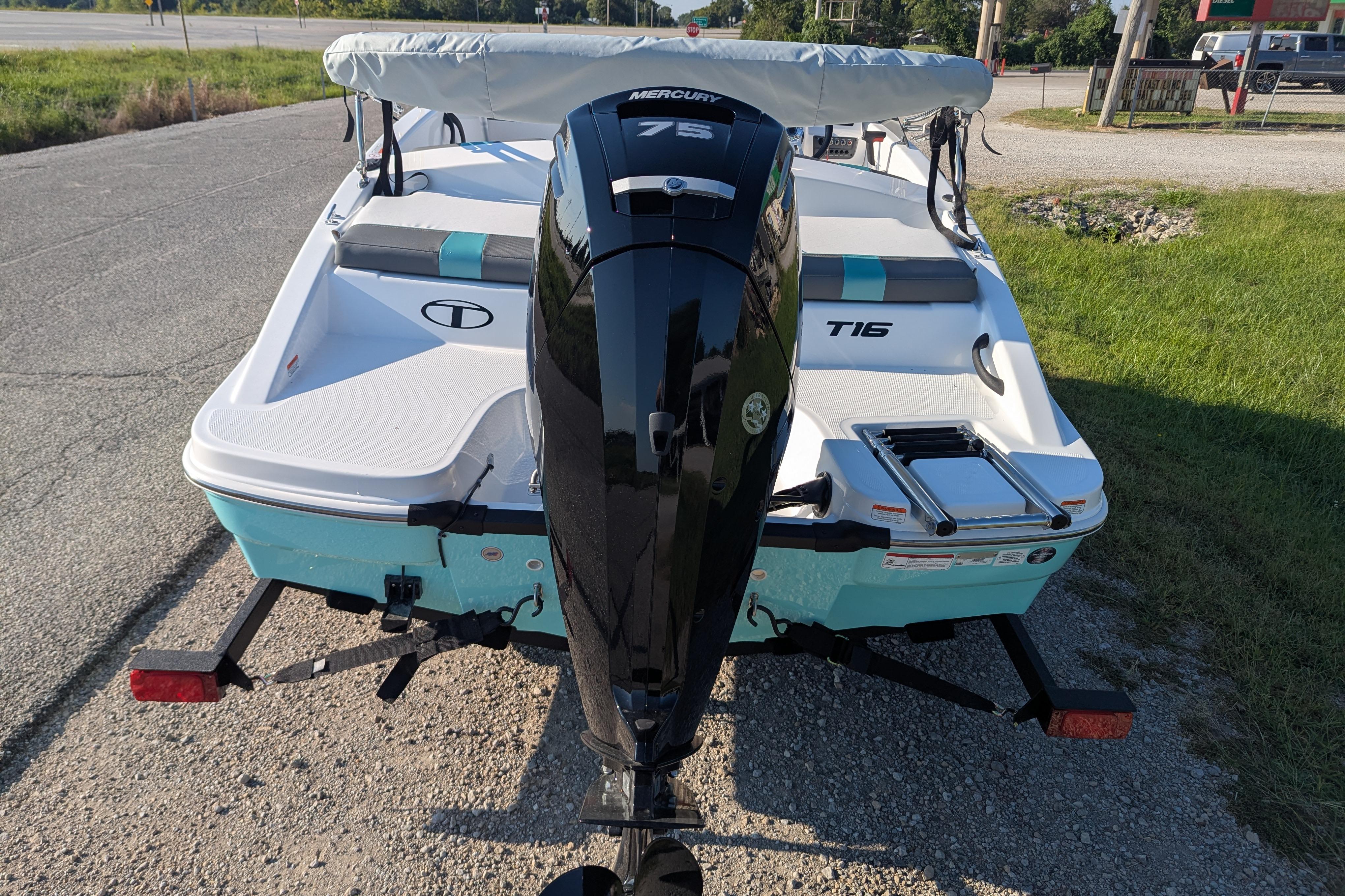2026 Tahoe T16 boat with Mercury 75 engine on a trailer, parked roadside.