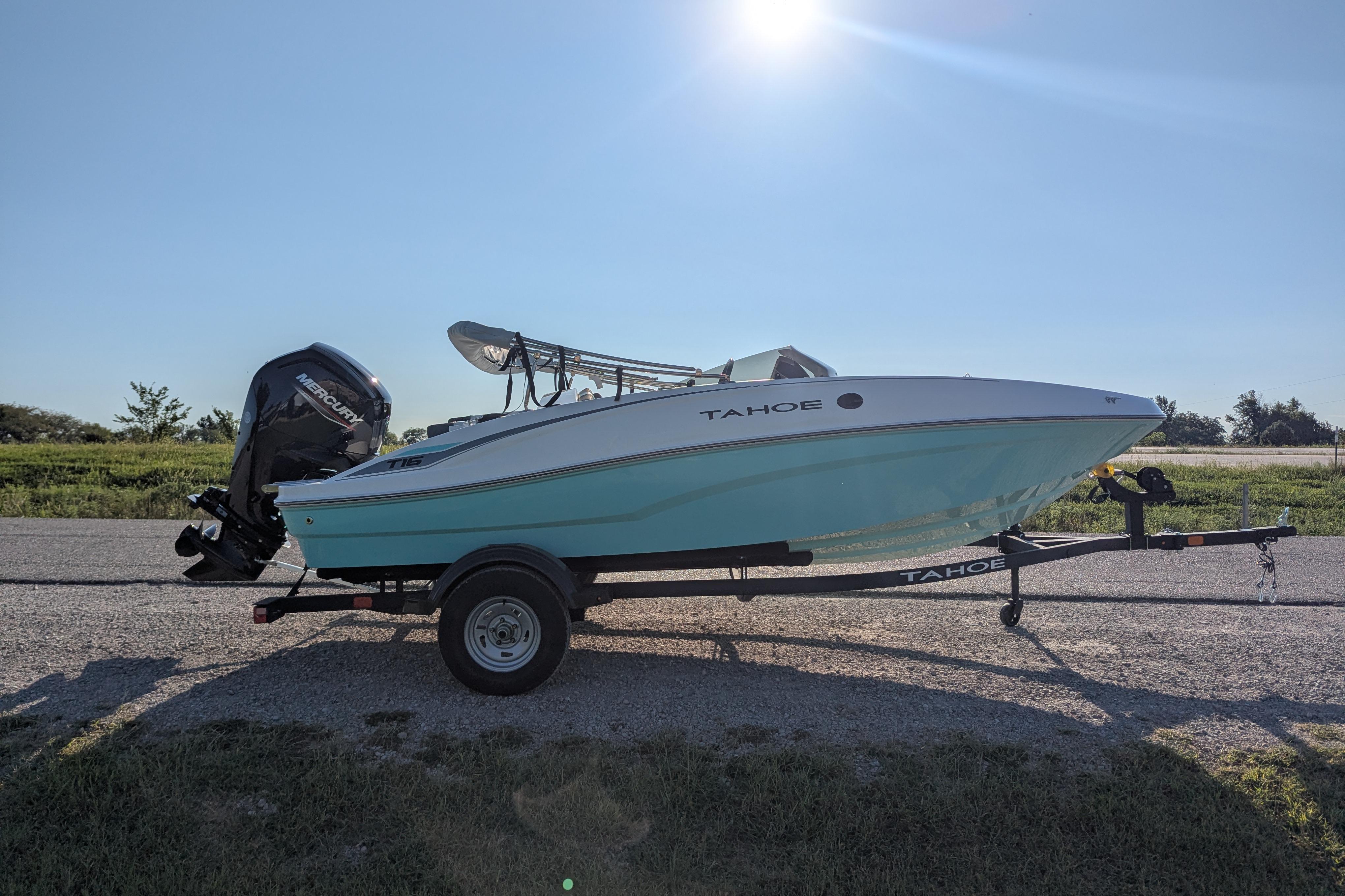 2026 Tahoe T16 boat on trailer under clear blue sky.