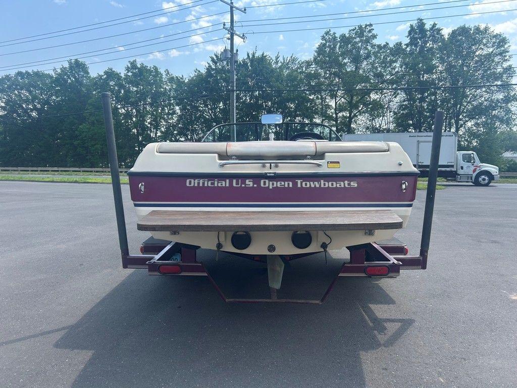 1999 Malibu Sunsetter VLX boat on trailer, labeled 
