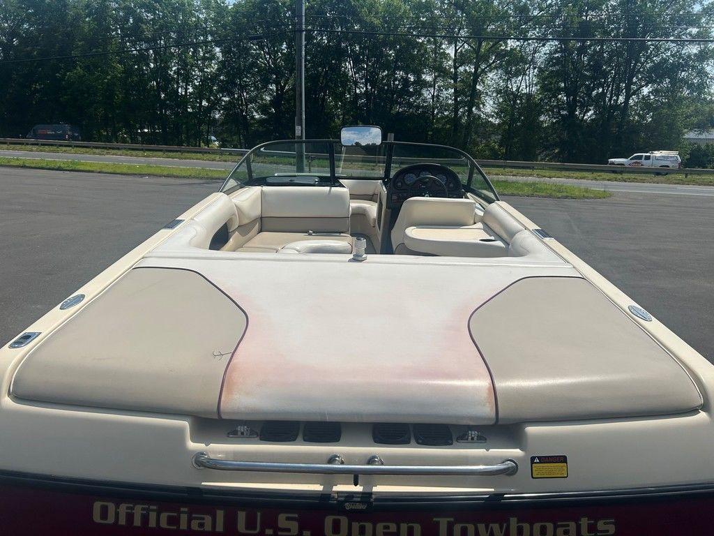 1999 Malibu Sunsetter VLX boat, rear view, parked outdoors, with 