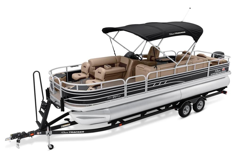 2021 Sun Tracker Fishin' Barge 24 DLX pontoon boat with canopy on trailer.