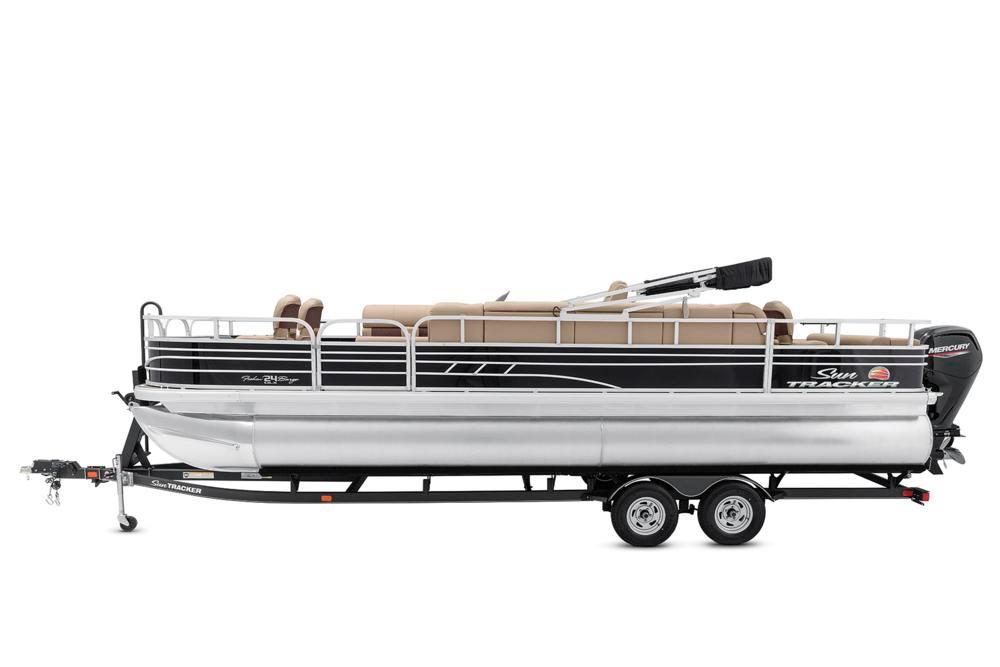 2021 Sun Tracker Fishin' Barge 24 DLX pontoon boat on trailer, side view.