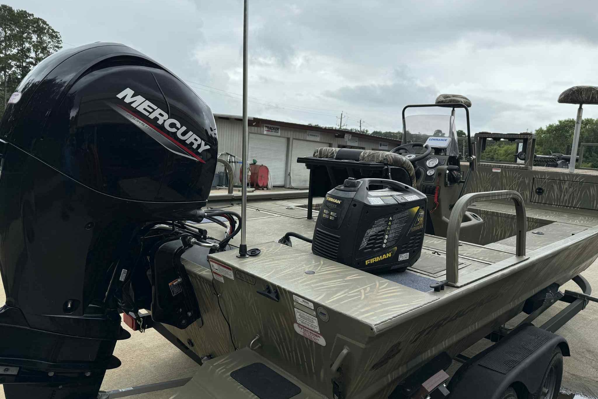 2022 Tracker Grizzly 2072 CC Sportsman boat with Mercury engine and Firman generator.