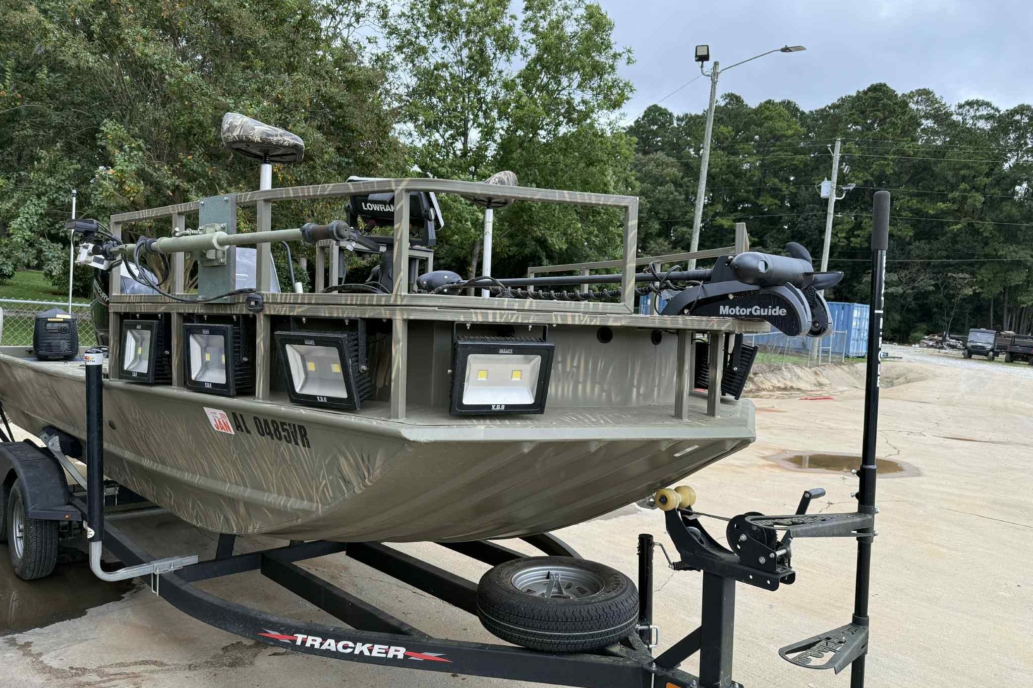 2022 Tracker Grizzly 2072 CC Sportsman boat on trailer, equipped with multiple lights.