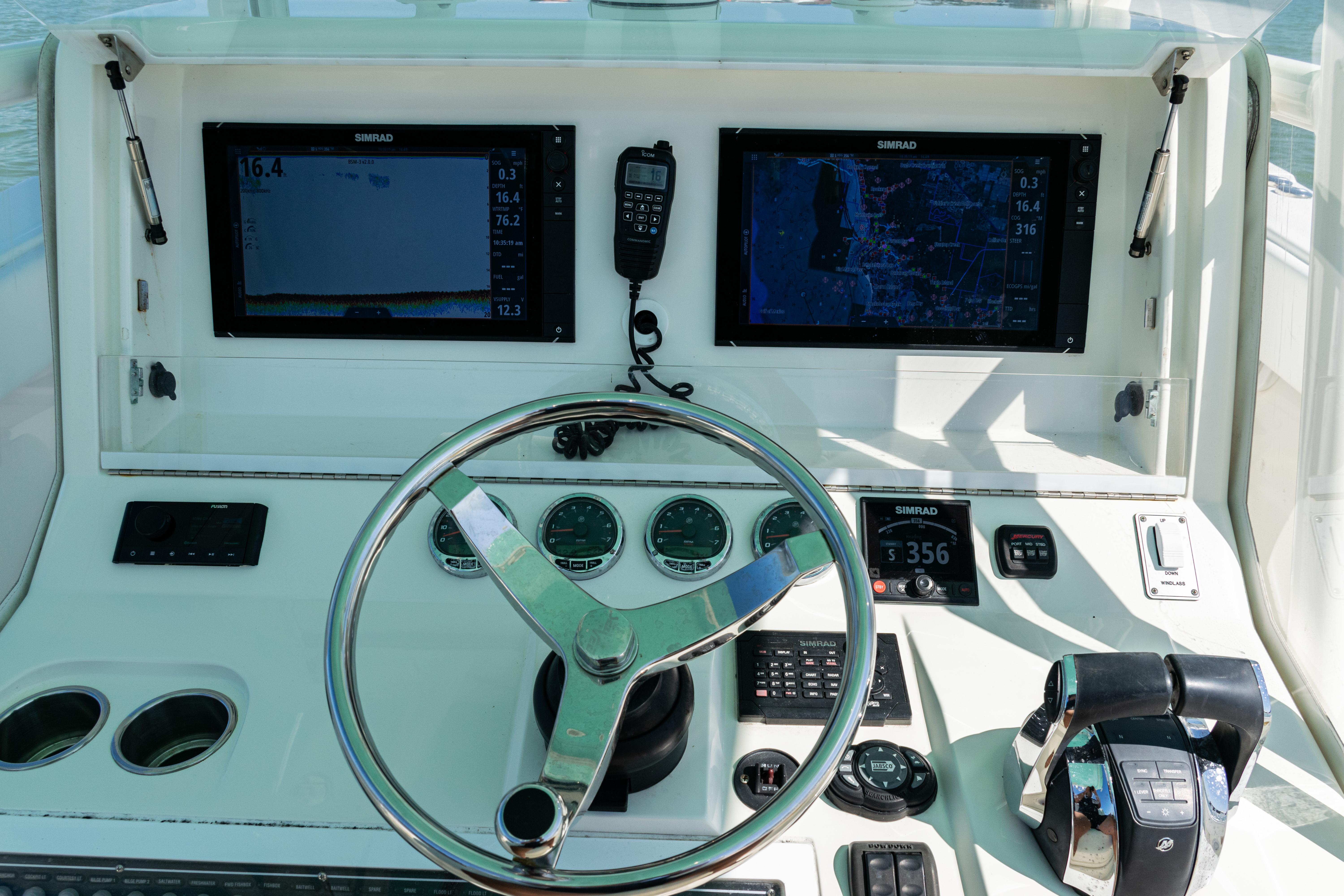 SeaVee-390Z 2015 -FL-US-Control panel of a 2015 SeaVee 390Z boat with dual screens and steering wheel.-9766060 | Thumbnail