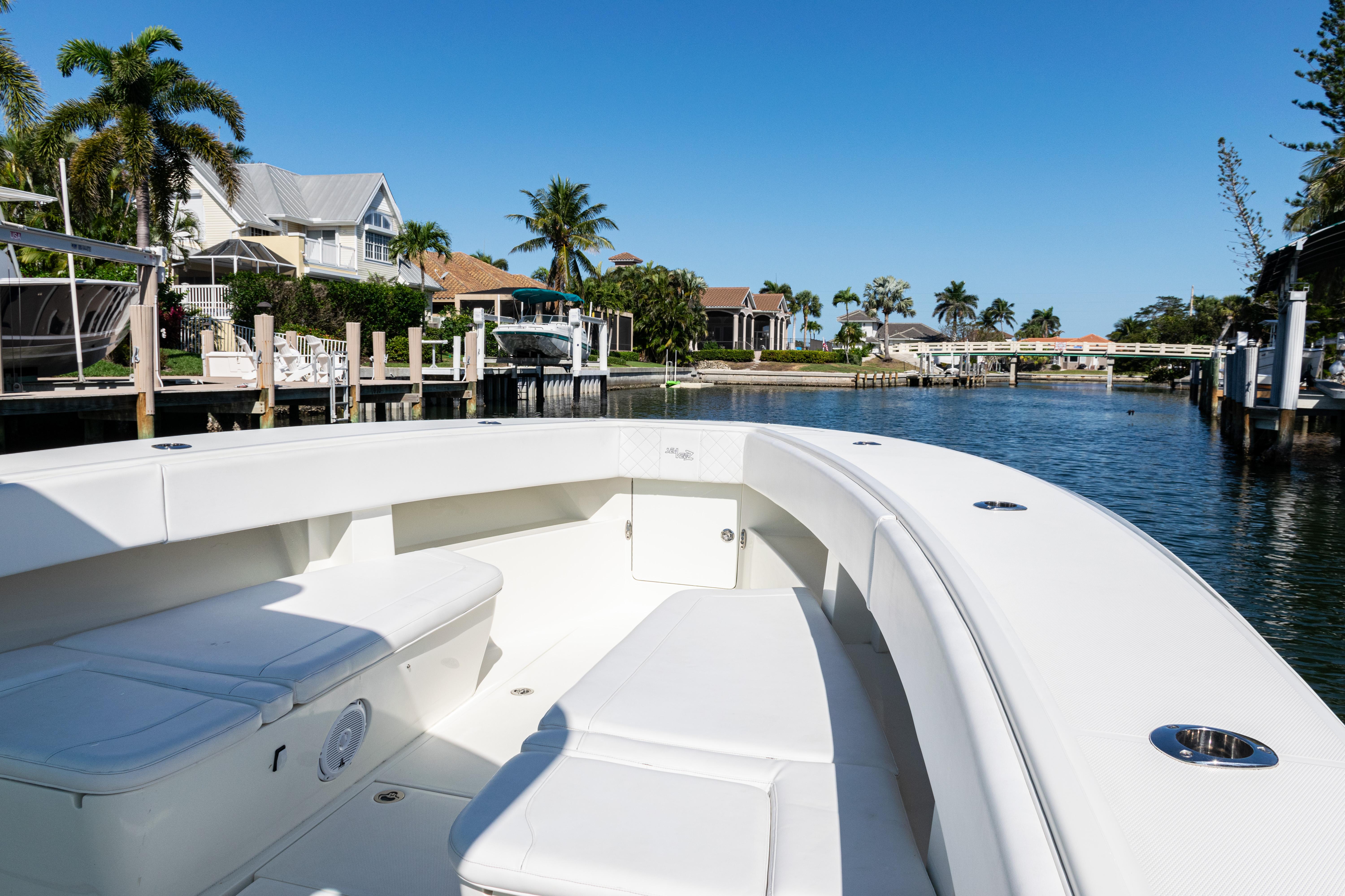 SeaVee-390Z 2015 -FL-US-2015 SeaVee 390Z boat on a sunny waterfront, showcasing spacious seating and sleek design.-9766060 | Thumbnail