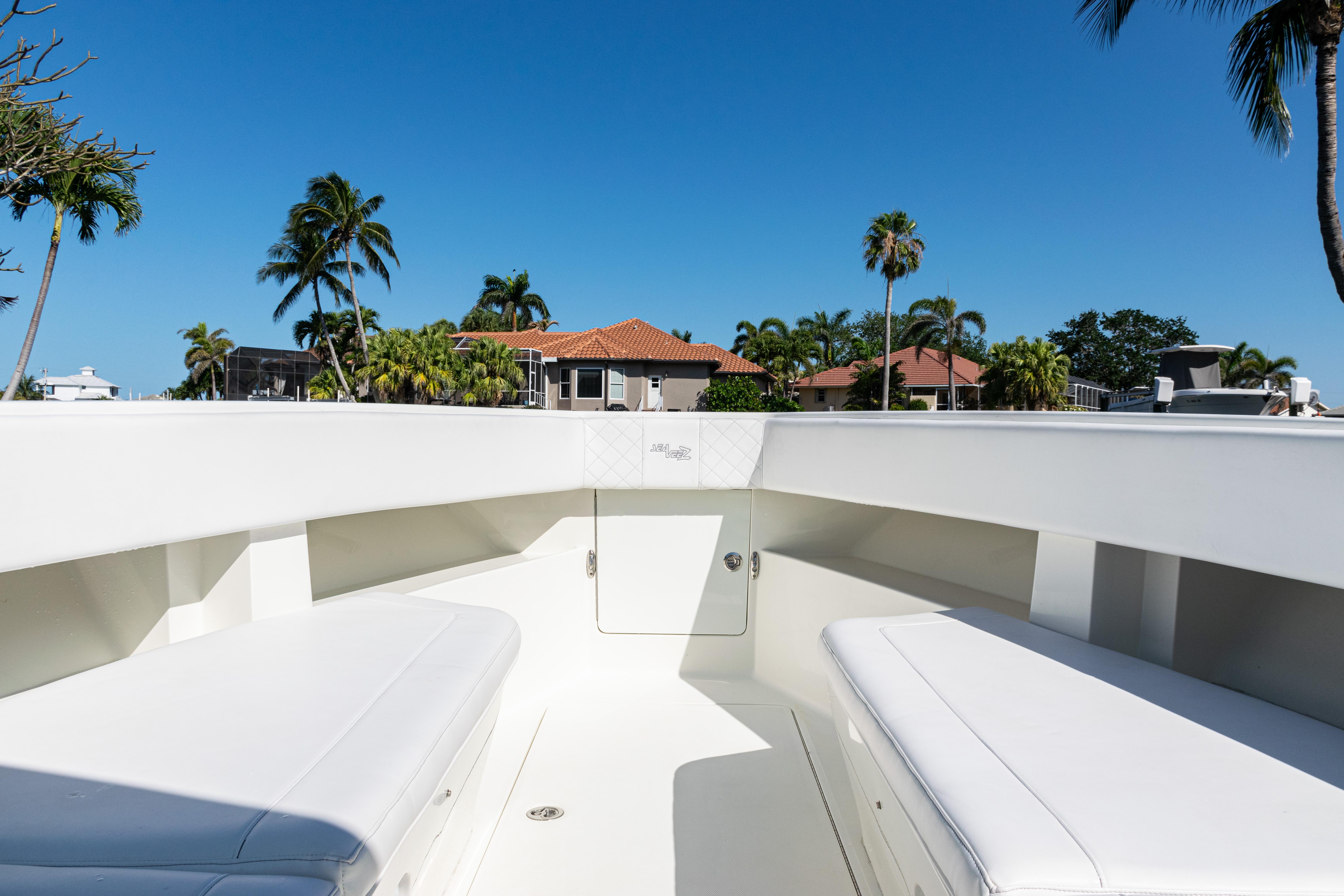 SeaVee-390Z 2015 -FL-US-2015 SeaVee 390Z boat interior with white seating, tropical background, and clear blue sky.-9766060 | Thumbnail