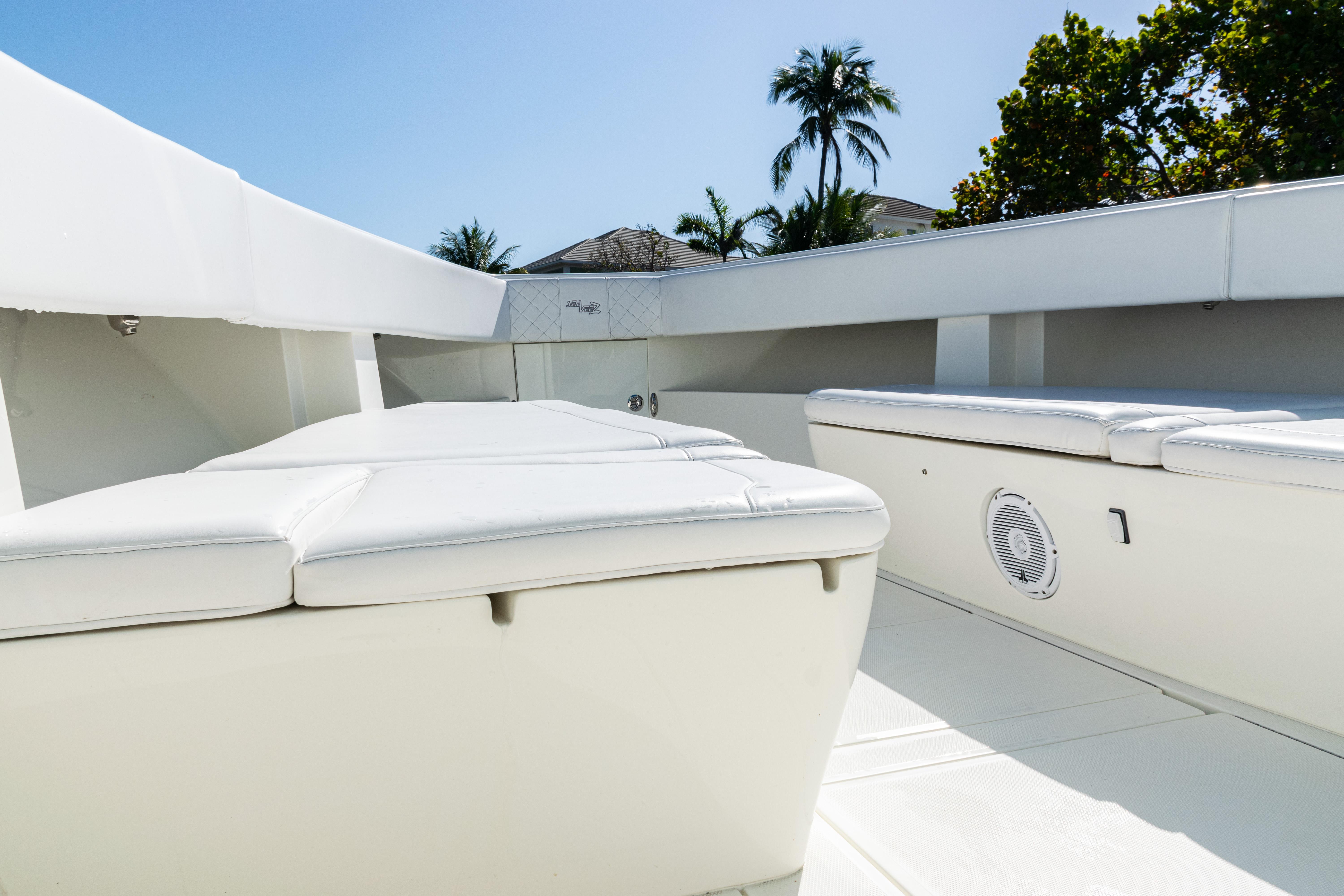 SeaVee-390Z 2015 -FL-US-2015 SeaVee 390Z boat interior with white seating, tropical background.-9766060 | Thumbnail