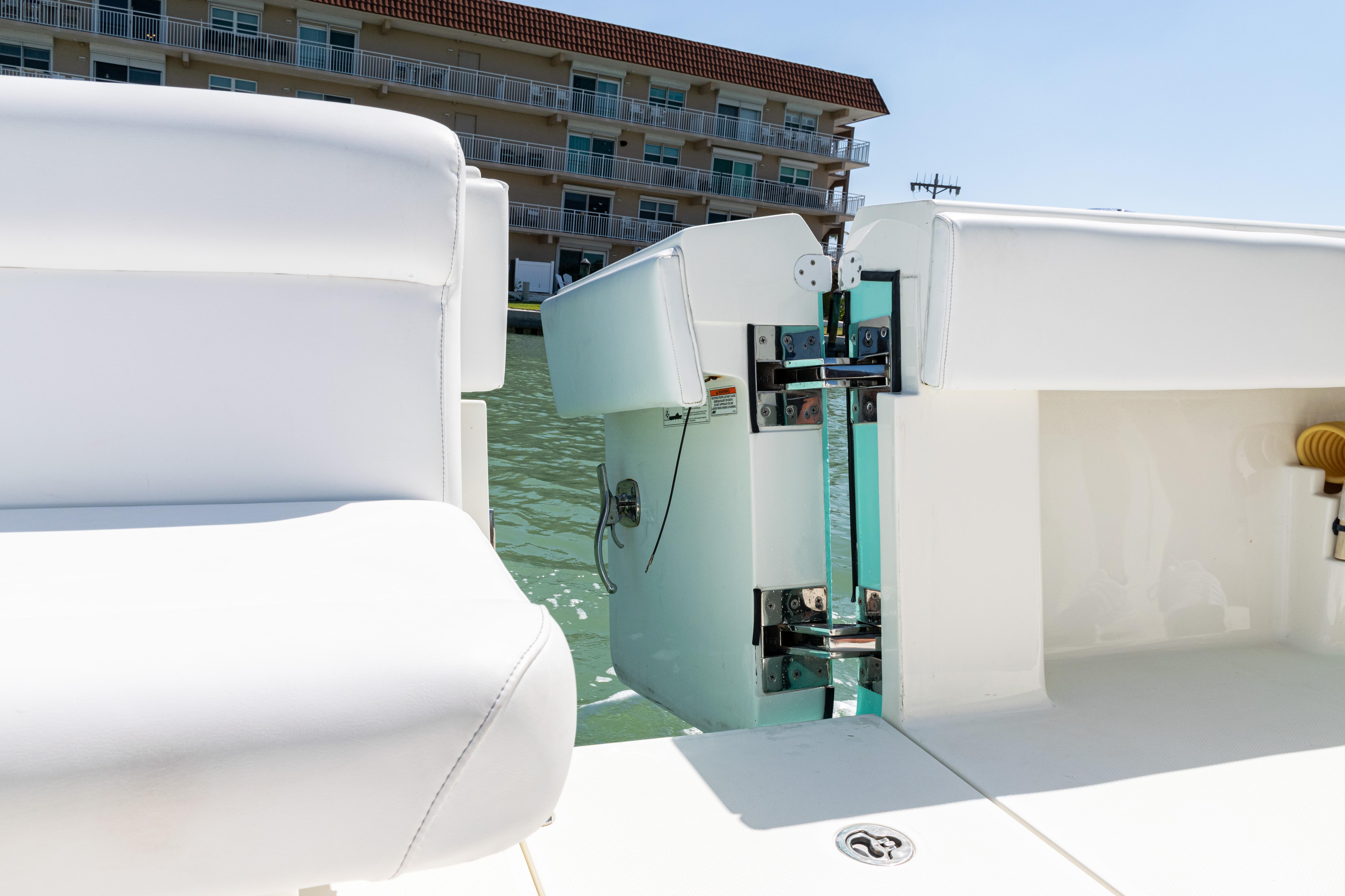 SeaVee-390Z 2015 -FL-US-2015 SeaVee 390Z boat with open transom door, docked near waterfront building.-9766060 | Thumbnail