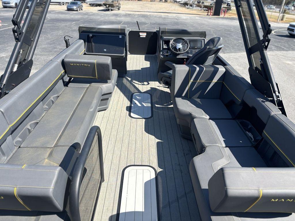 2023 Manitou Explore 22 Max Bench interior with spacious seating and modern dashboard.